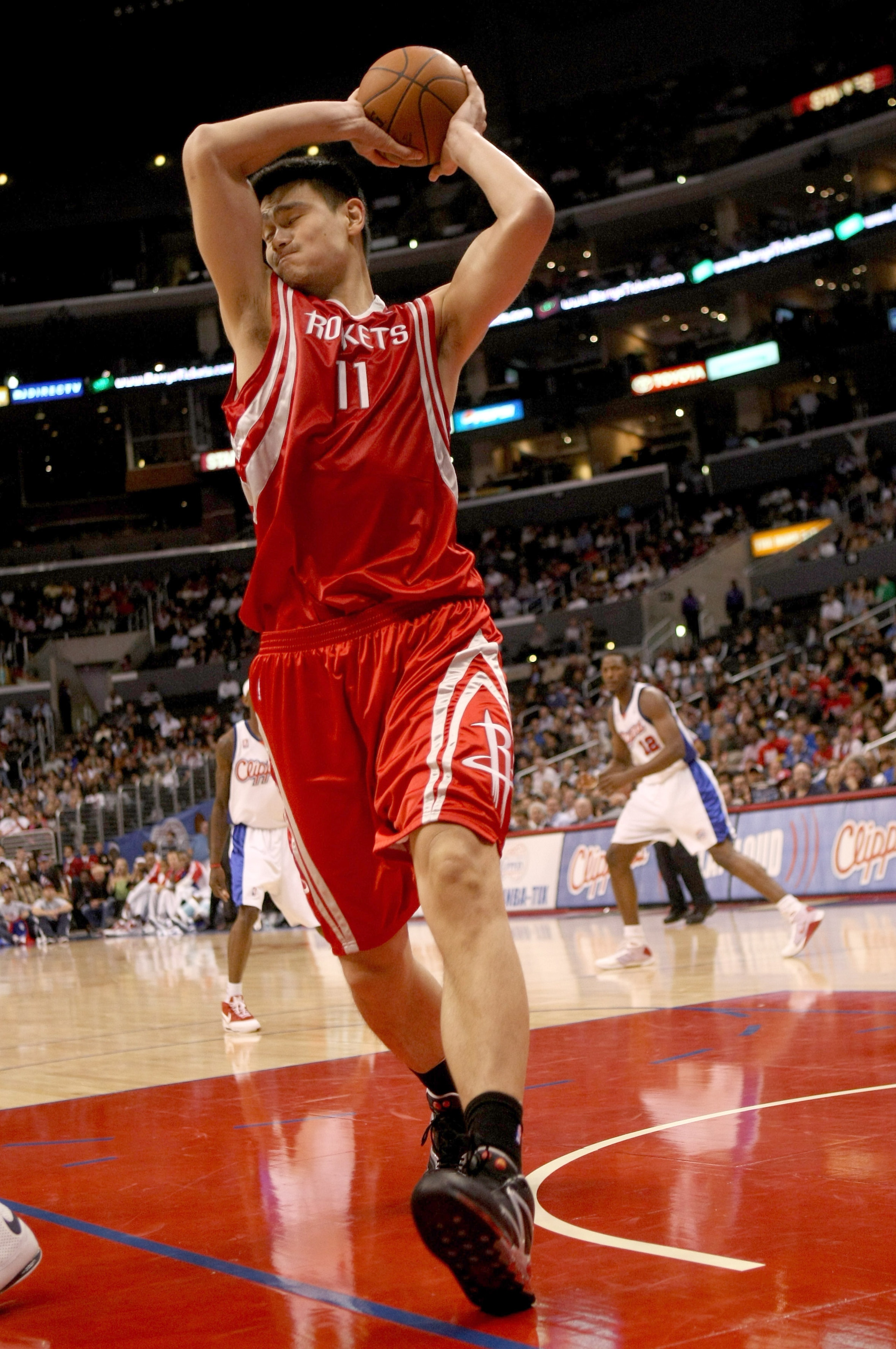 LOS ANGELES, CA - NOVEMBER 07:  Yao Ming #11 of the Houston Rockets grabs a rebound against the Los Angeles Clippers on November 7, 2008 at Staples Center in Los Angeles, California.  The Rockets won 92-83.   NOTE TO USER: User expressly acknowledges and