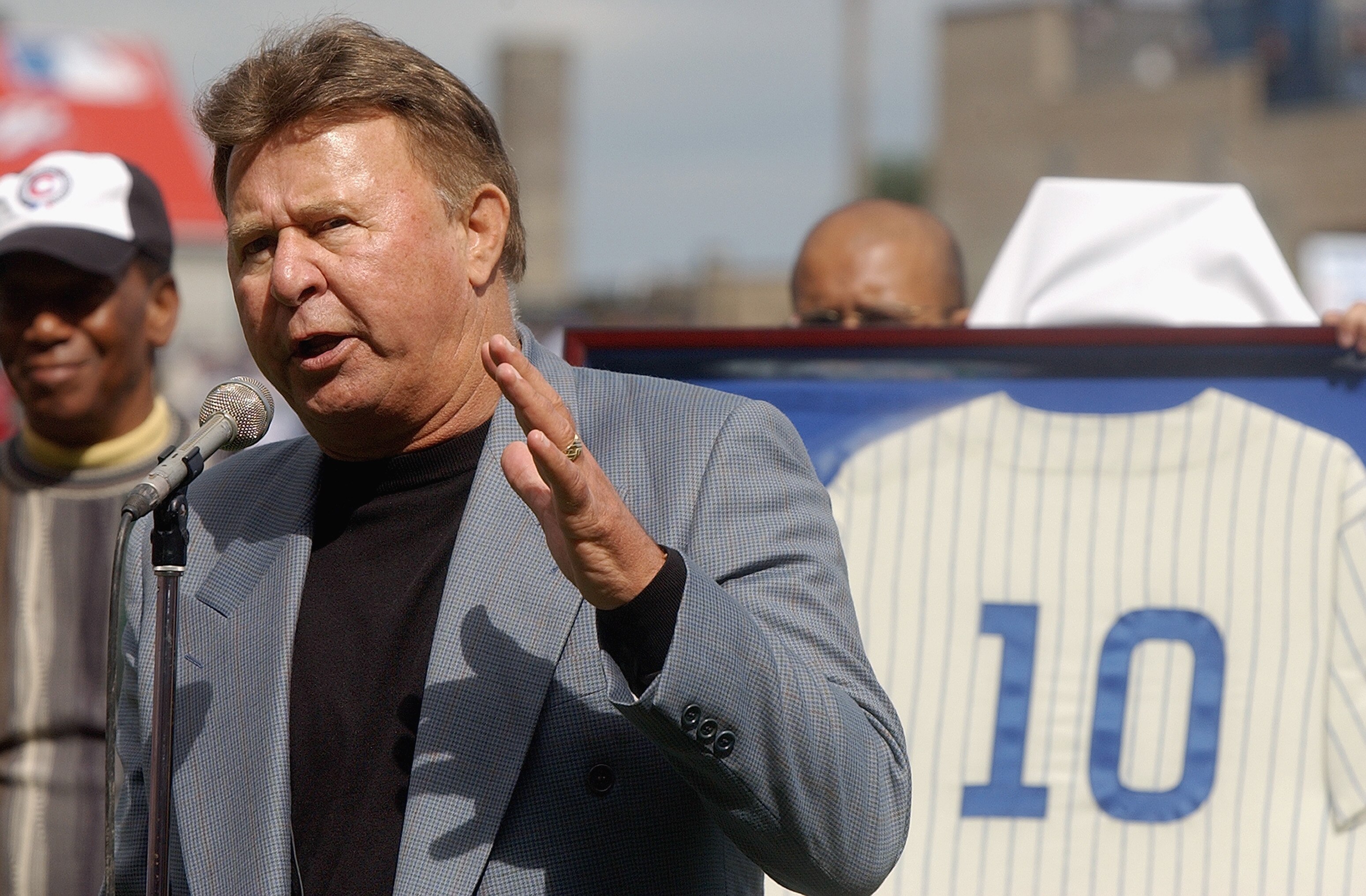 CHICAGO - SEPTEMBER 28:  Former Chicago Cub third baseman Ron Santo speaks to the fans during a retirement ceremony for Santo's uniform number 10 before a game against the Pittsburgh Pirates on September 28, 2003 at Wrigley Field in Chicago, Illinois.  Th