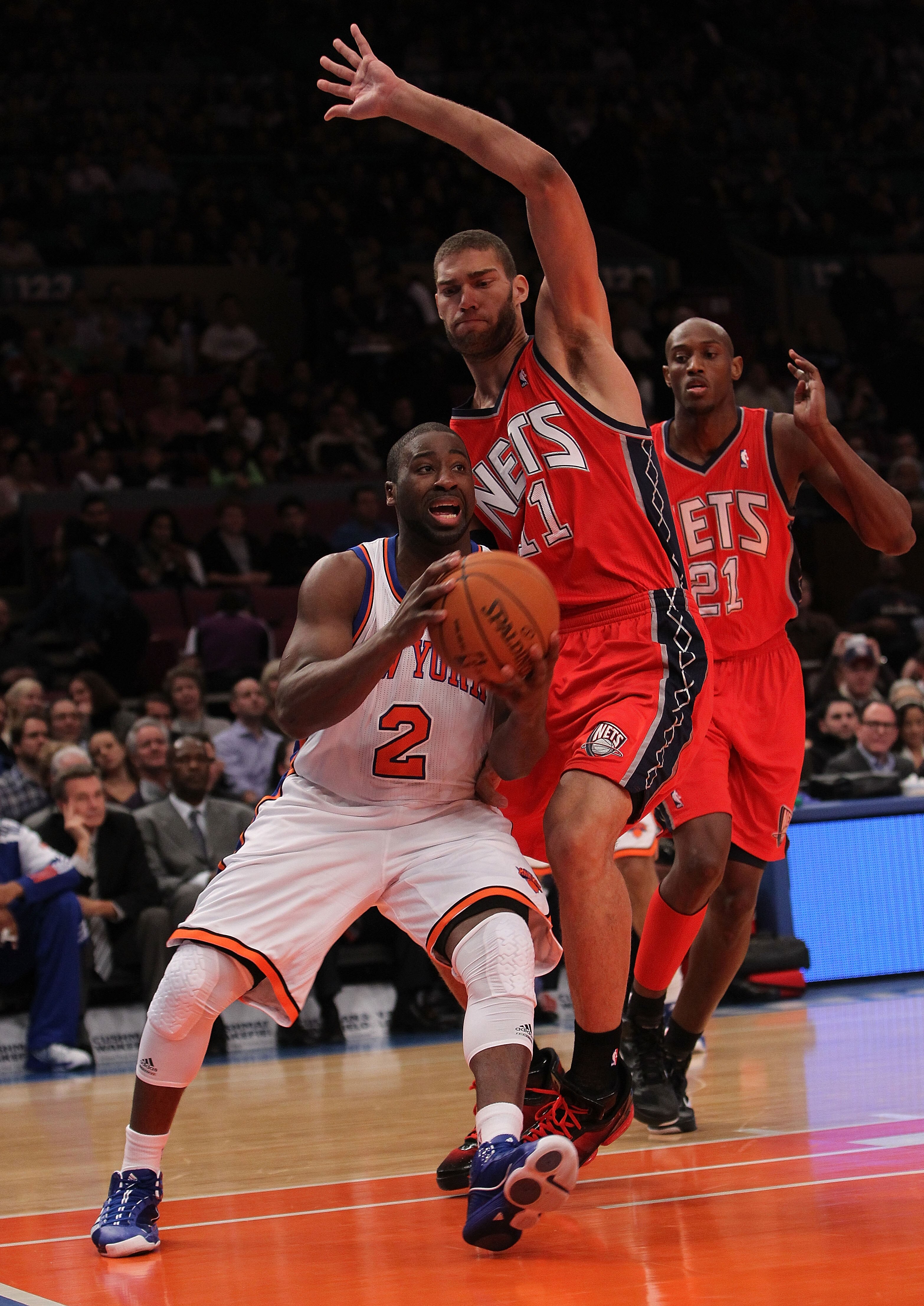 NEW YORK, NY - NOVEMBER 30:  Raymond Felton #2 of the New York Knicks drives to the basket against Brook Lopez #11 of the New Jersey Nets on November 30, 2010 at Madison Square Garden in New York City. NOTE TO USER: User expressly acknowledges and agrees 