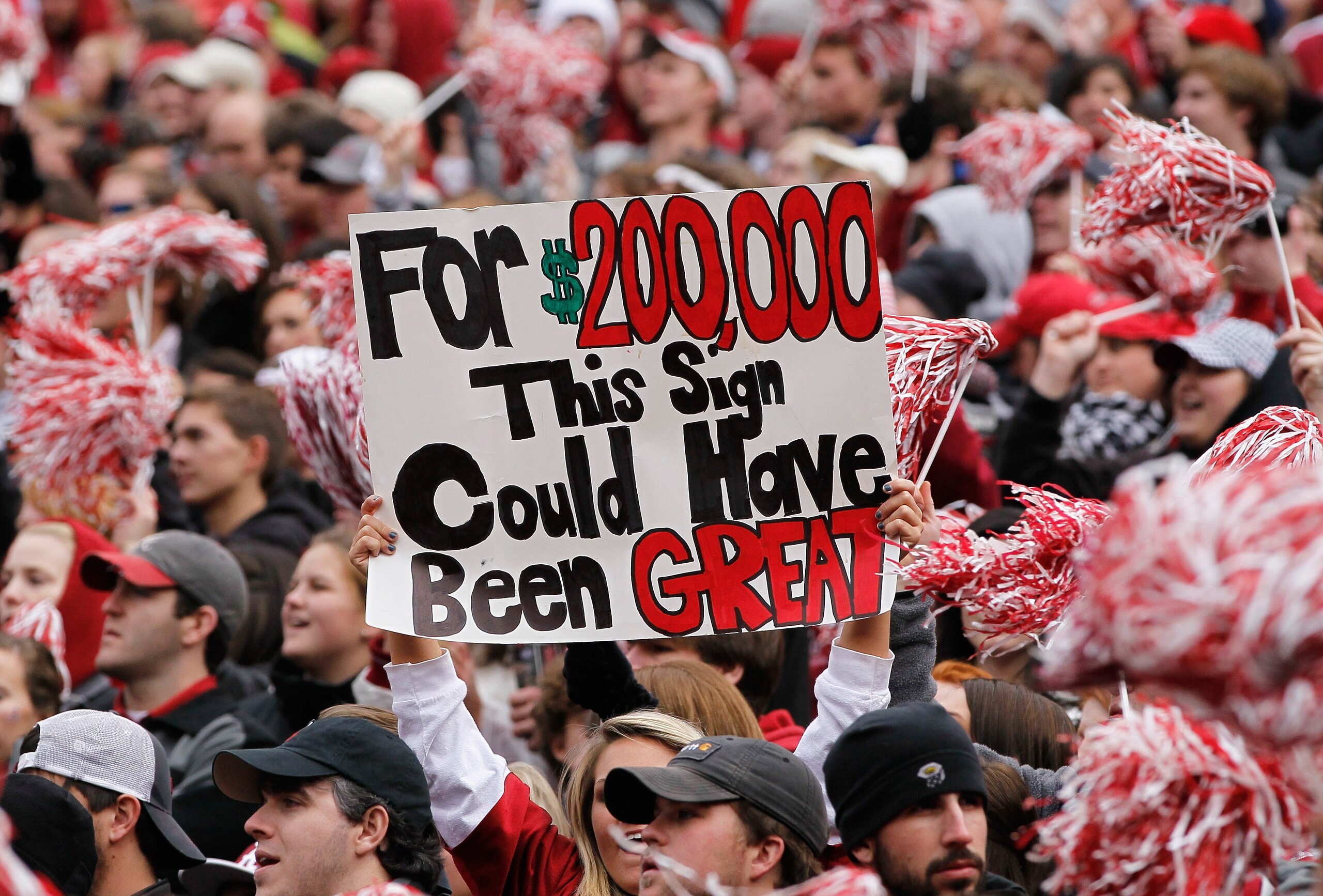 TUSCALOOSA, AL - NOVEMBER 26:  A fan of the Alabama Crimson Tide holds up a sign during the game against the Auburn Tigers at Bryant-Denny Stadium on November 26, 2010 in Tuscaloosa, Alabama.  (Photo by Kevin C. Cox/Getty Images)