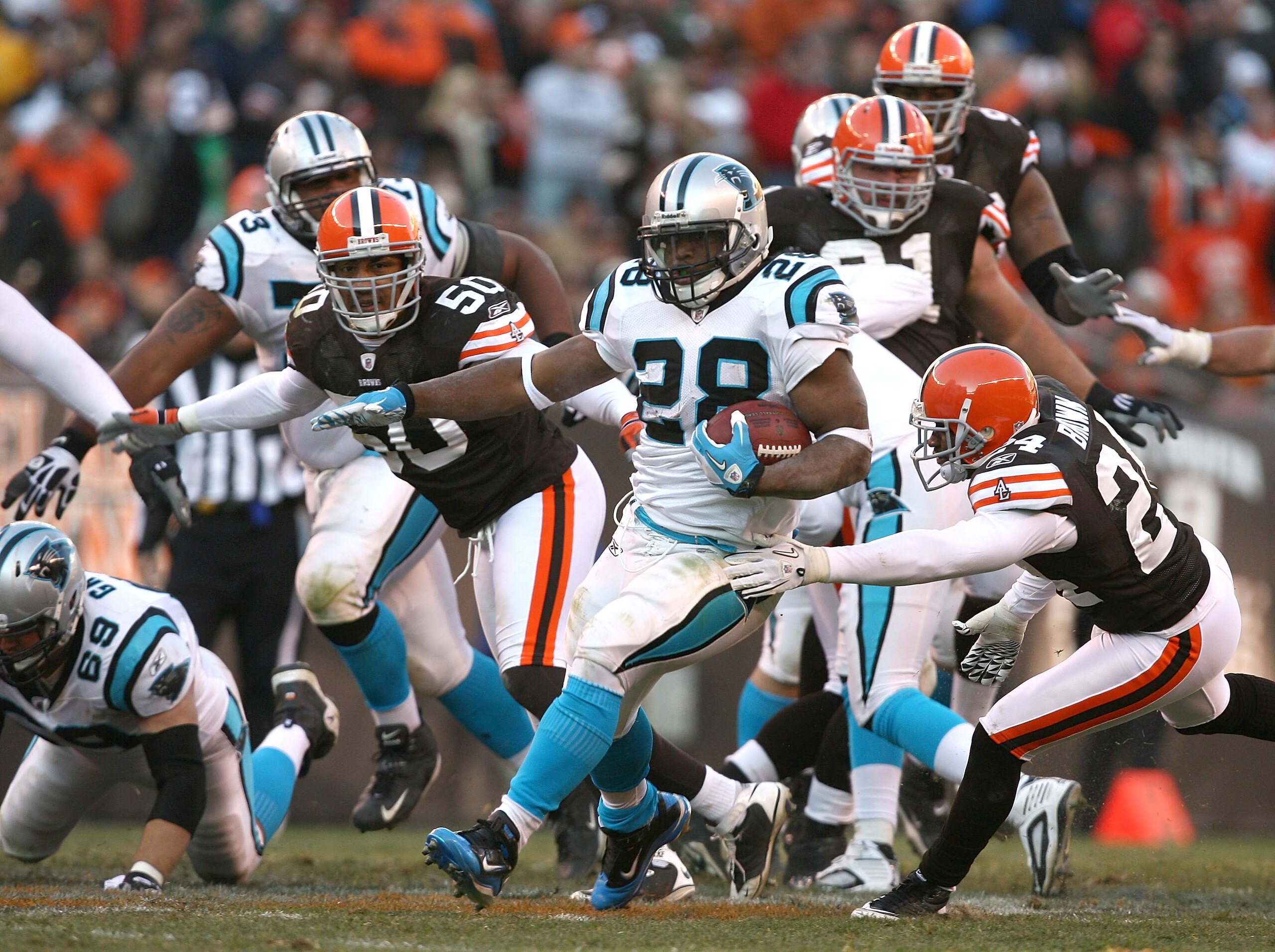 CLEVELAND - NOVEMBER 28:  Running back Jonathan Stewart #28 of the Carolina Panthers runs by defensive back Sheldon Brown #24 and linebacker Eric Barton #50 of the Cleveland Browns at Cleveland Browns Stadium on November 28, 2010 in Cleveland, Ohio.  (Pho
