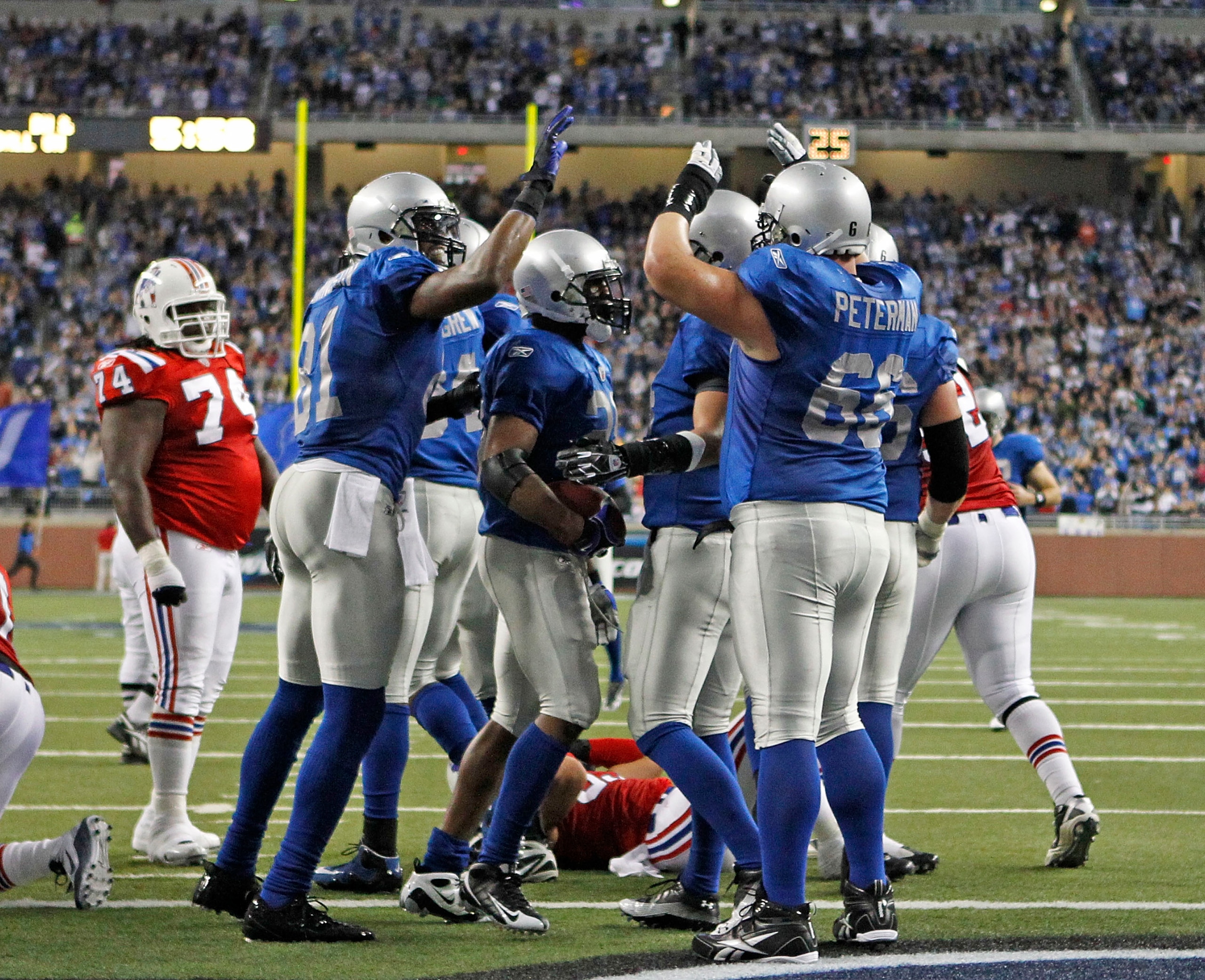 DETROIT - NOVEMBER 25:  Maurice Morris #28 of the Detroit Lions celebrates with teammates after scoring on a one yard run in the second quarter to give the Lions a 14-3 lead over the New England Patriots at Ford Field on November 25, 2010 in Detroit, Mich