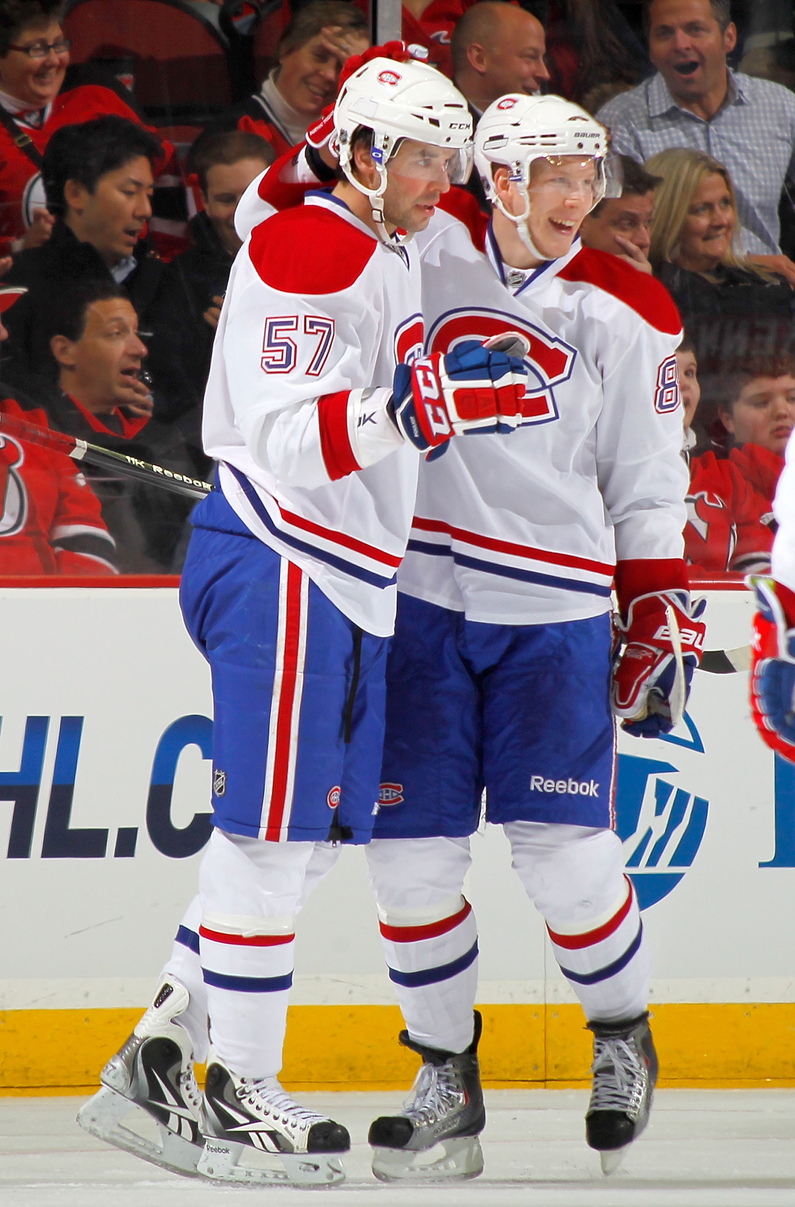 NEWARK, NJ - DECEMBER 02:  Benoit Pouliot #57 and Lars Eller #81 of the Montreal Canadiens celebrate a goal by Pouliot during the second period of a hockey game against the New Jersey Devils at the Prudential Center on December 2, 2010 in Newark, New Jers