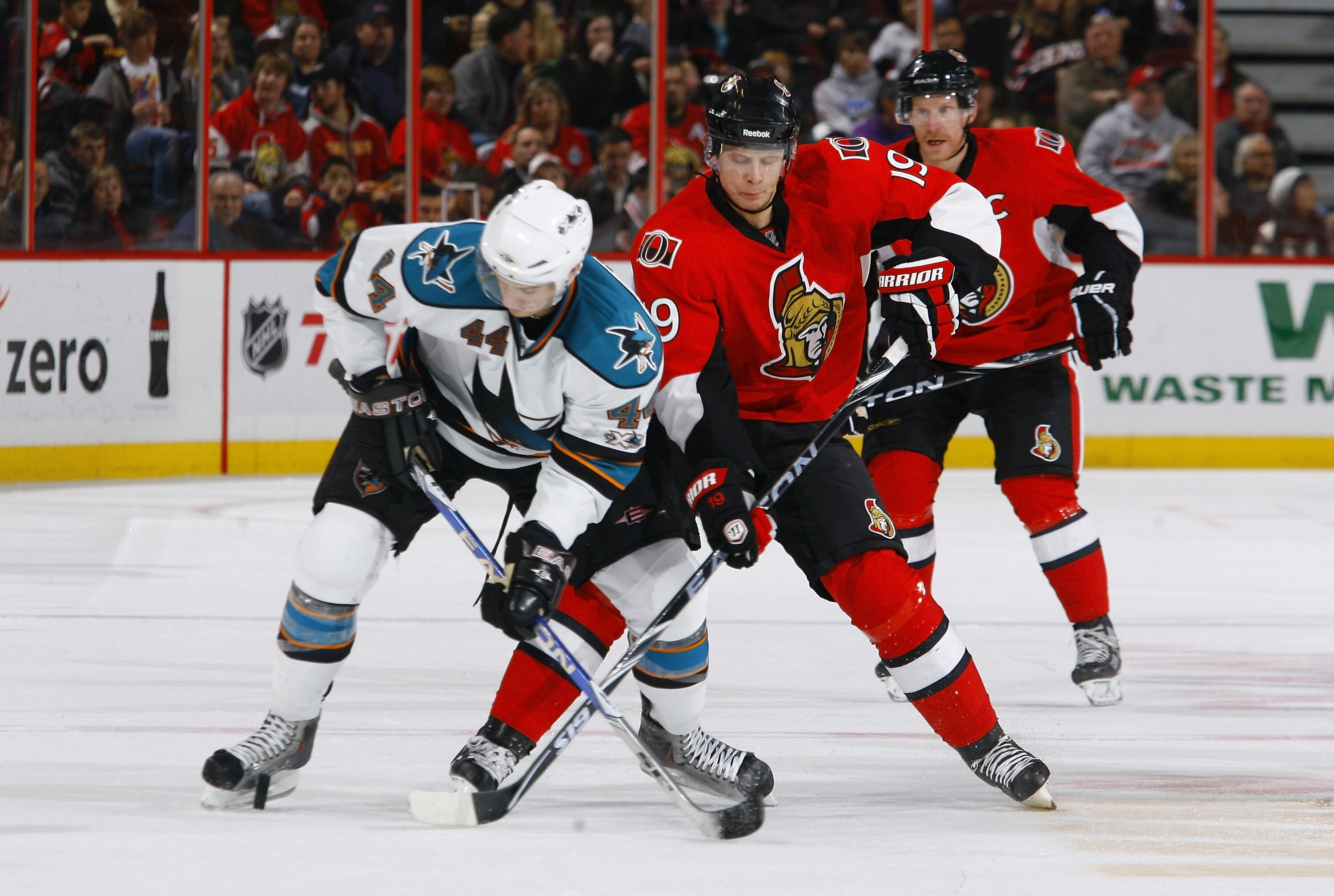 OTTAWA, ON - DECEMBER 02:  Marc-Eduard Vlasic #44 of the San Jose Sharks battles for the puck with Jason Spezza #19 of the Ottawa Senators in a game at Scotiabank Place on December 2, 2010 in Ottawa, Ontario, Canada.  (Photo by Phillip MacCallum/Getty Ima
