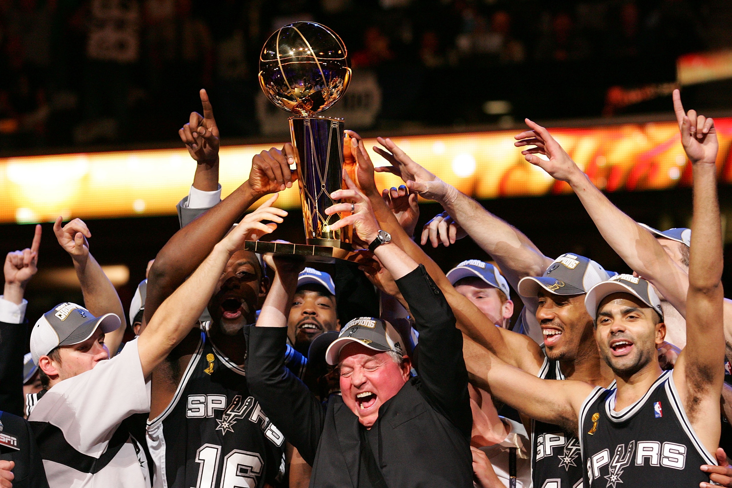 CLEVELAND - JUNE 14: Owner Peter Holt and the San Antonio Spurs receive the Larry O'Brien Championship Trophy after Game Four of the NBA Finals on June 14, 2007 at the Quicken Loans Arena in Cleveland, Ohio. NOTE TO USER: User expressly acknowledges and a CLEVELAND - JUNE 14: Owner Peter Holt and the San Antonio Spurs receive the Larry O'Brien Championship Trophy after Game Four of the NBA Finals on June 14, 2007 at the Quicken Loans Arena in Cleveland, Ohio. NOTE TO USER: User expressly acknowledges and a