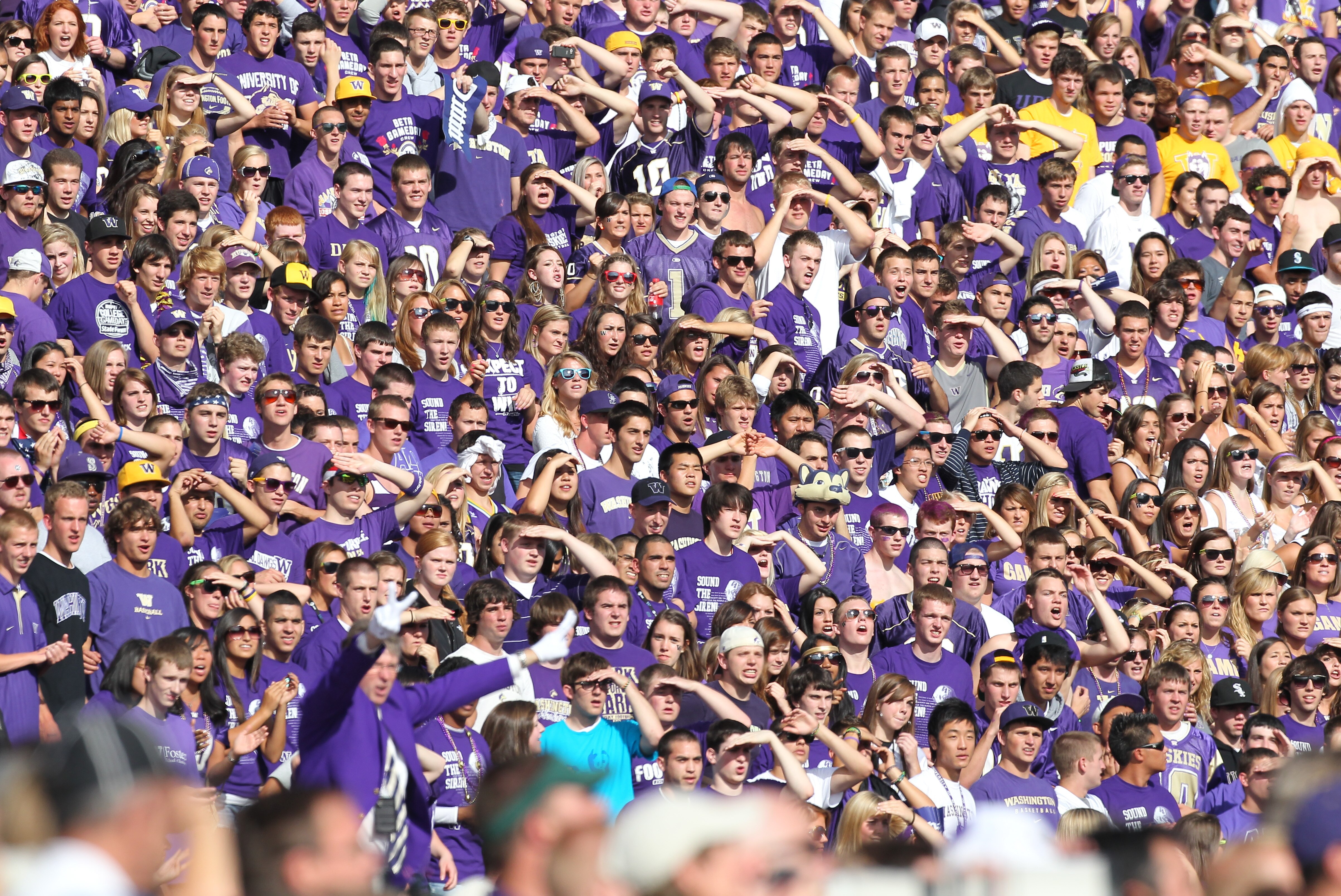 SEATTLE - SEPTEMBER 11:  Fans of the Washington Huskies watch their team take the field prior to the game against the Syracuse Orange on September 11, 2010 at Husky Stadium in Seattle, Washington. (Photo by Otto Greule Jr/Getty Images)