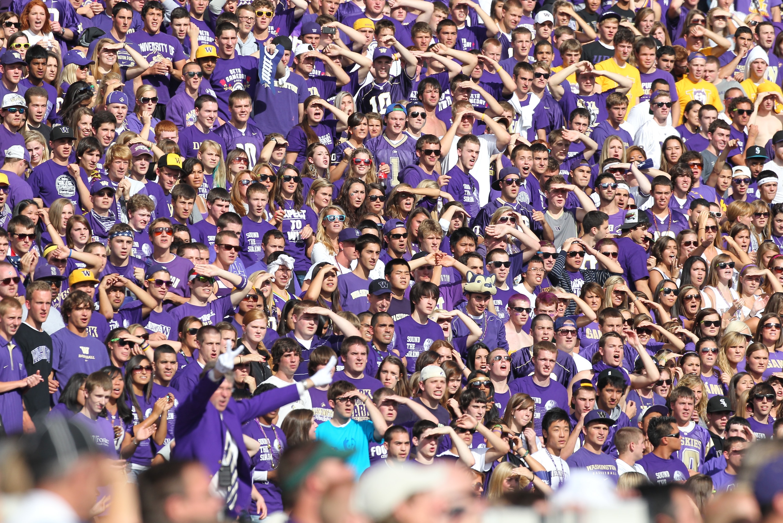 SEATTLE - SEPTEMBER 11:  Fans of the Washington Huskies watch their team take the field prior to the game against the Syracuse Orange on September 11, 2010 at Husky Stadium in Seattle, Washington. (Photo by Otto Greule Jr/Getty Images)