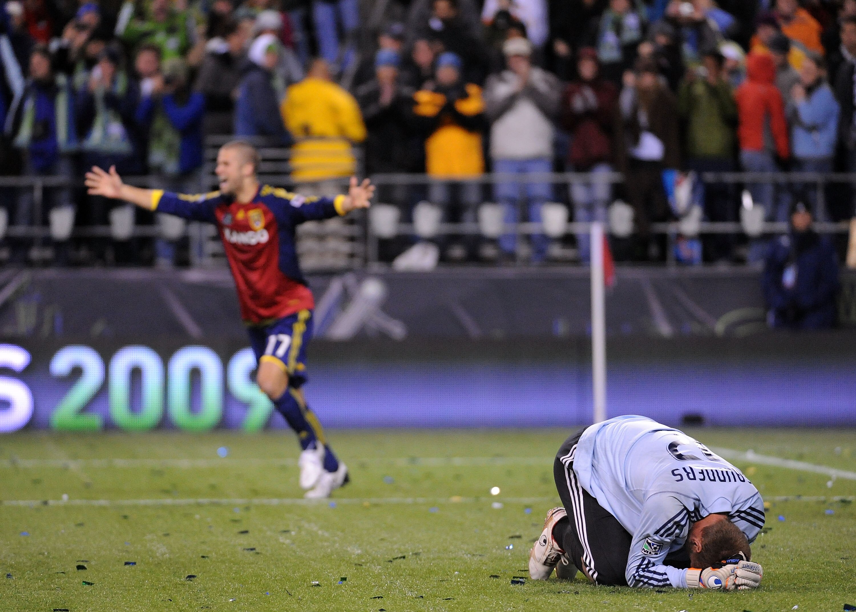 SEATTLE - NOVEMBER 22:  Josh Saunders (R) #12 of the Los Angeles Galaxy reacts after allowing the game winning goal as Chris Wingert (L) #17 of Real Salt Lake celebrates during the MLS Cup final at Qwest Field on November 22, 2009 in Seattle, Washington.