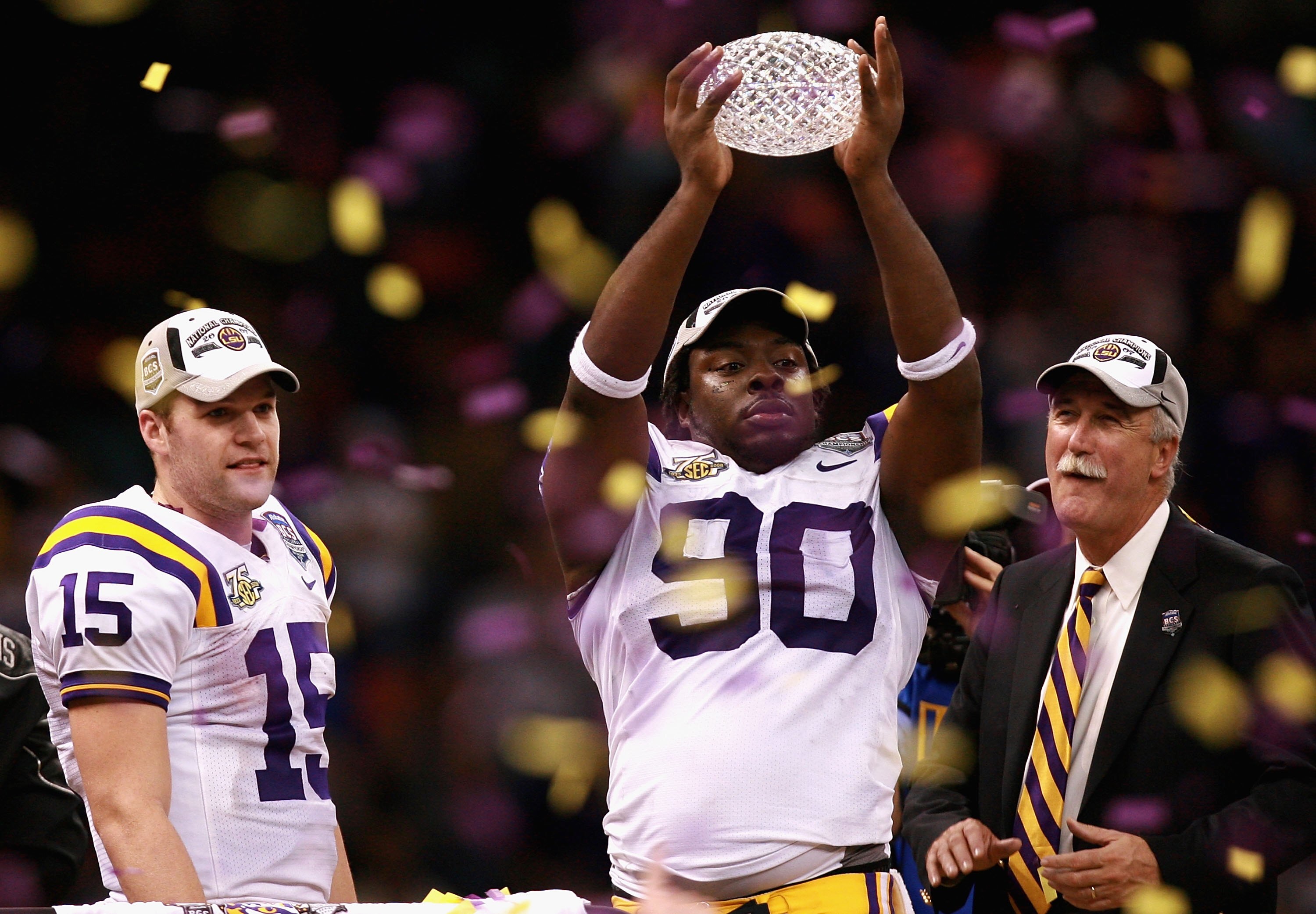 NEW ORLEANS - JANUARY 07:  Ricky Jean-Francois #90 of the Louisiana State University Tigers celebrates with the championship trophy after defeating the Ohio State Buckeyes 38-24 in the AllState BCS National Championship on January 7, 2008 at the Louisiana
