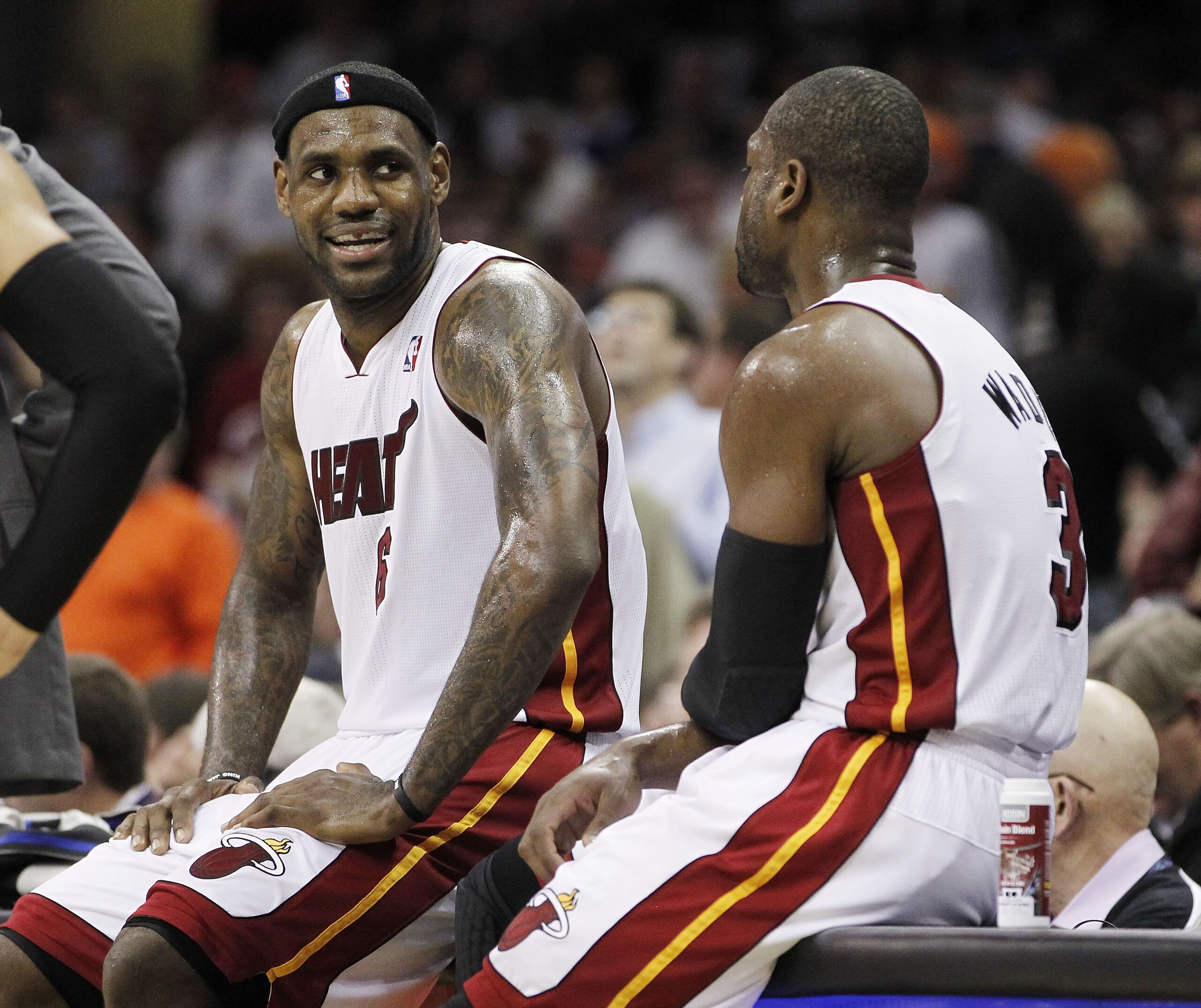 CLEVELAND, OH - DECEMBER 02:  LeBron James #6 of the Miami Heat talks to Dwyane Wade #3 while playing the Cleveland Cavaliers at Quicken Loans Arena on December 2, 2010 in Cleveland, Ohio. NOTE TO USER: User expressly acknowledges and agrees that, by down