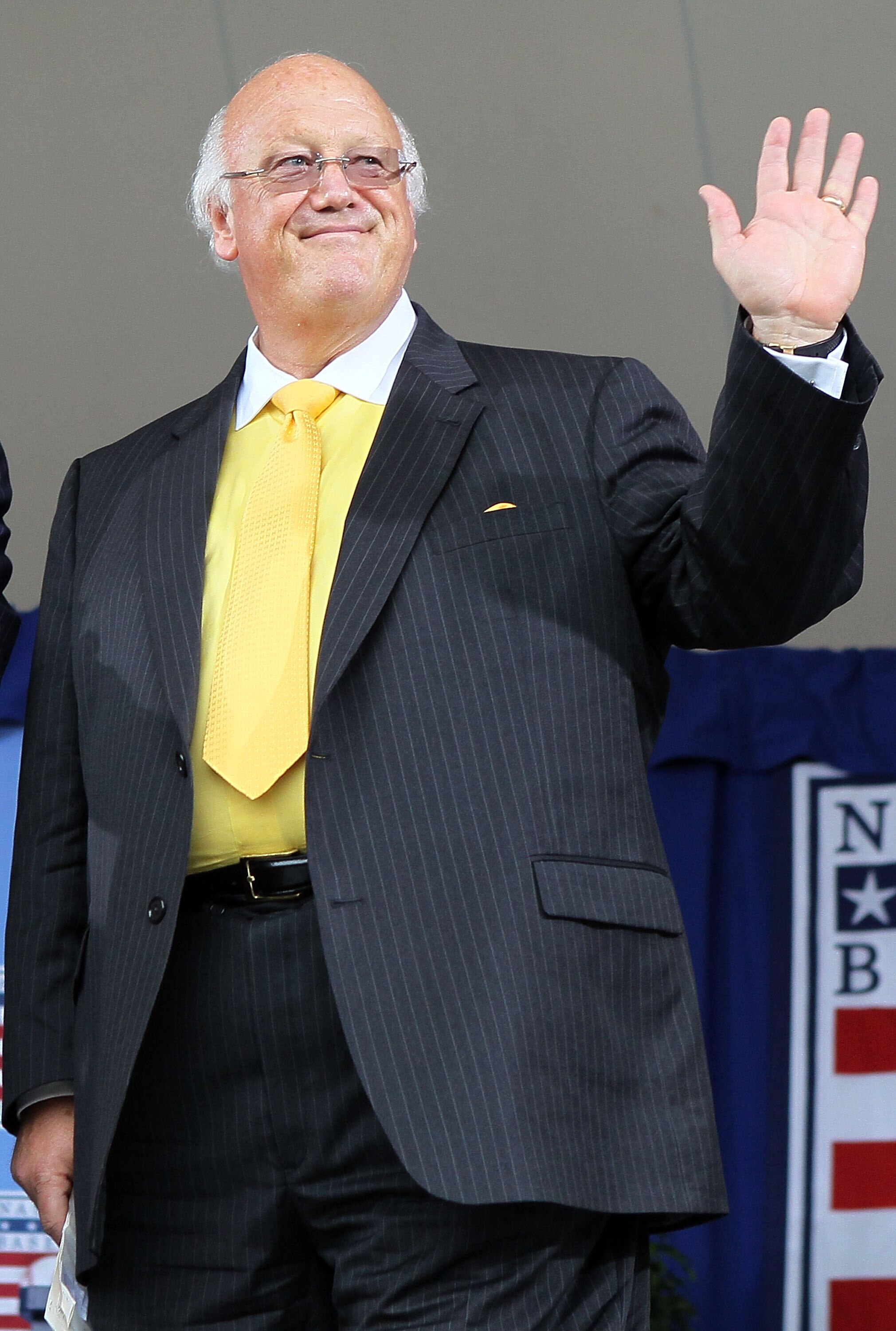 COOPERSTOWN, NY - JULY 25:  Jon Miller waves to the crowd prior to receiving the Ford C. Frick award for contributions in baseball broadcasting at Clark Sports Center during the Baseball Hall of Fame induction ceremony on July 25, 20010 in Cooperstown, Ne