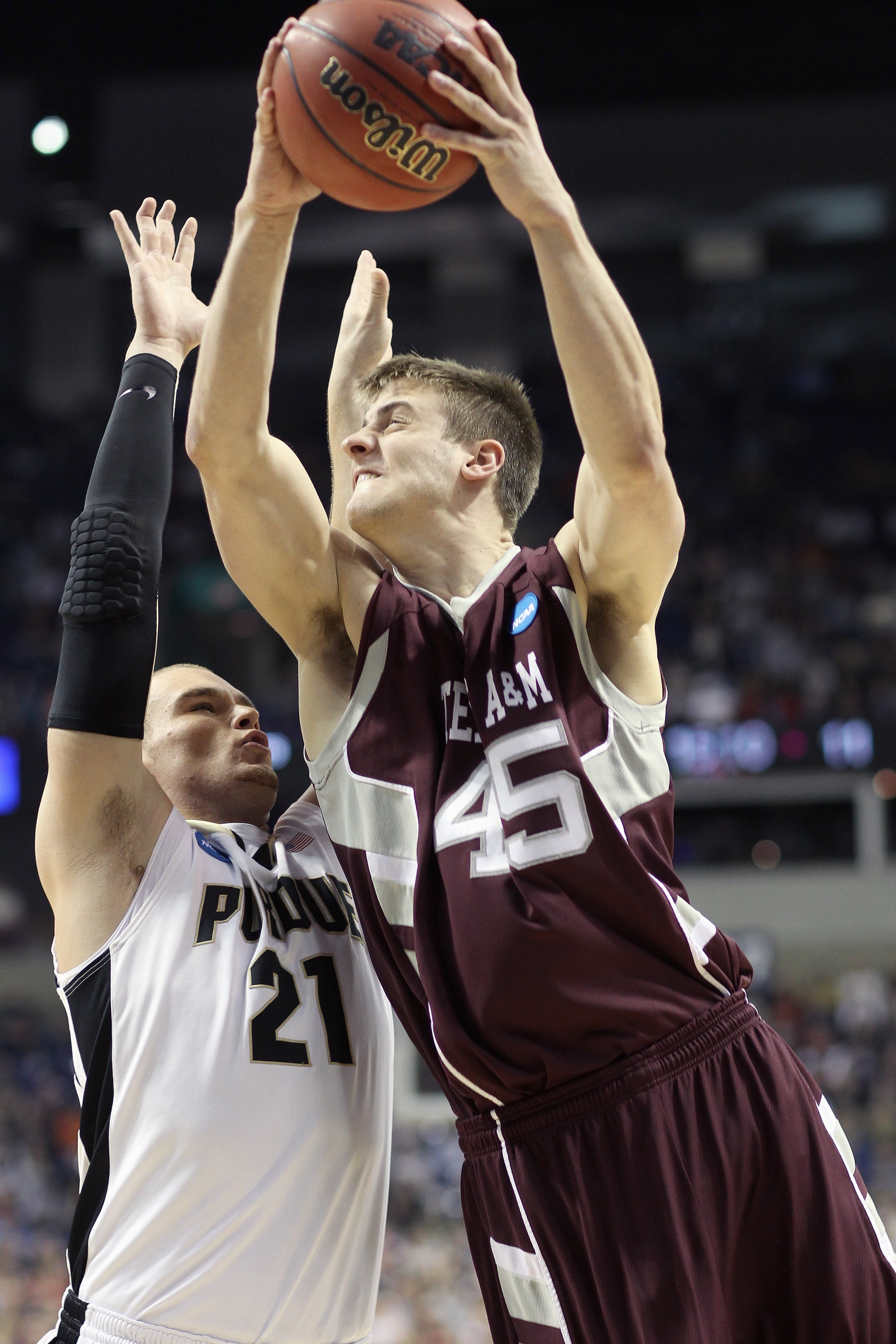 SPOKANE, WA - MARCH 21: Nathan Walkup #45 of the Texas A&M Aggies shoots against D.J. Byrd #21 of the Purdue Boilermakers during the second round of the 2010 NCAA men's basketball tournament at the Spokane Arena on March 21, 2010 in Spokane, Washington. P
