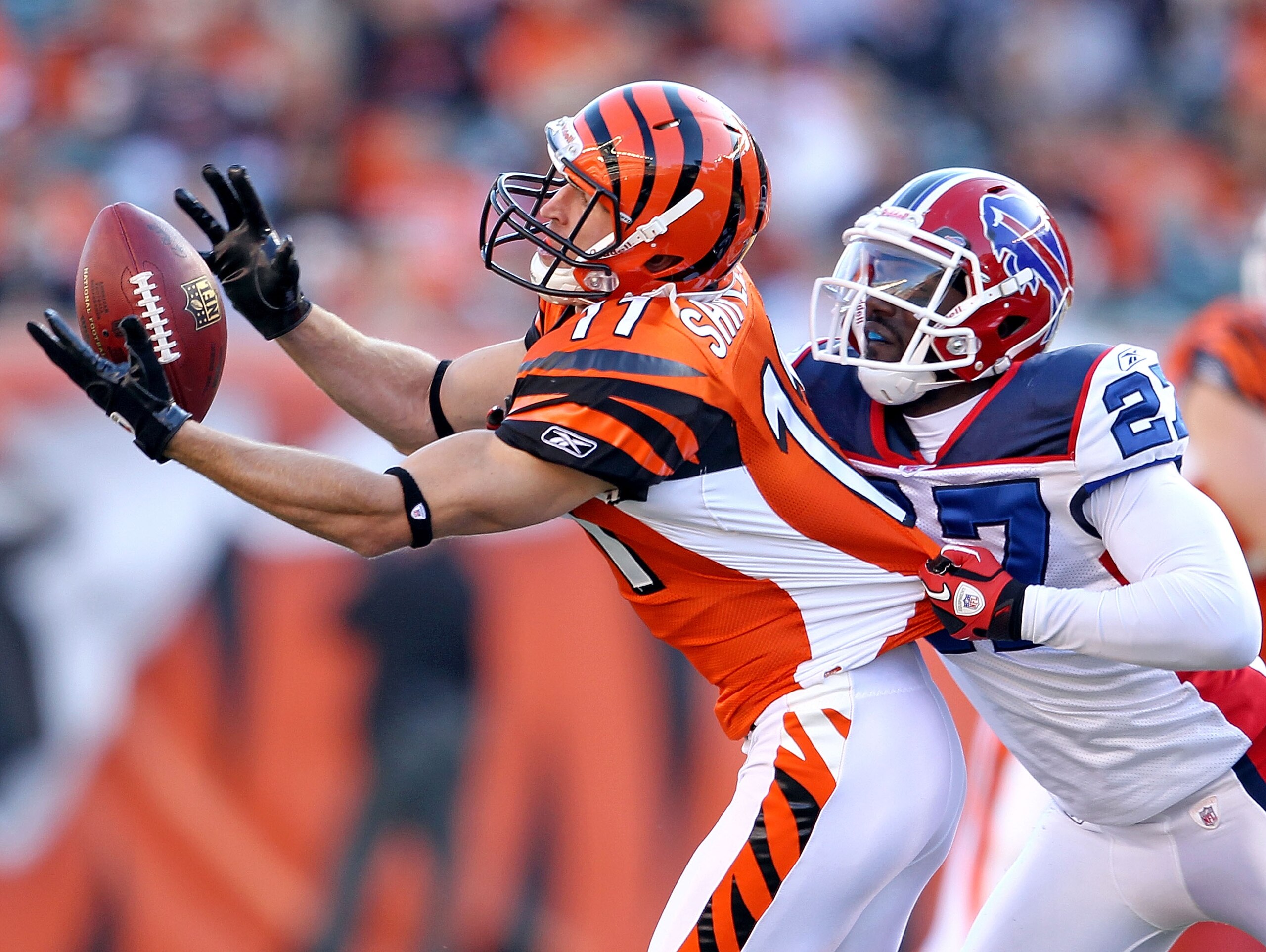 CINCINNATI - NOVEMBER 21:  Jordan Shipley #11 of the Cincinnati Bengals reaches for a pas while defended by Reggie Corner #27 of the Buffalo Bills during the NFL game  at Paul Brown Stadium on November 21, 2010 in Cincinnati, Ohio.  The Bills won 49-31.