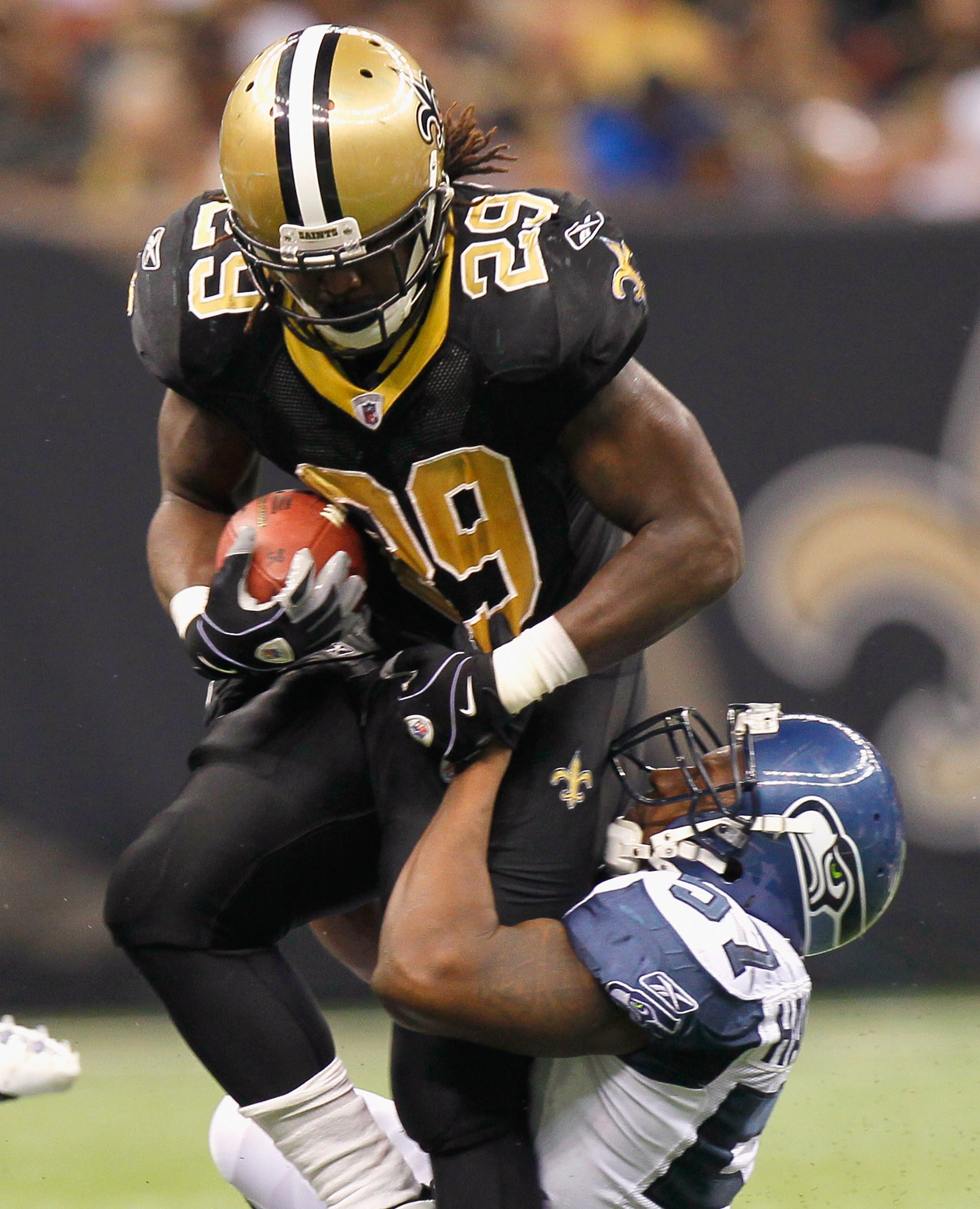 NEW ORLEANS - NOVEMBER 21: Chris Ivory #29 of the New Orleans Saints is tackled by David Hawthorne #57 of the Seattle Seahawks at Louisiana Superdome on November 21, 2010 in New Orleans, Louisiana. (Photo by Kevin C. Cox/Getty Images) NEW ORLEANS - NOVEMBER 21: Chris Ivory #29 of the New Orleans Saints is tackled by David Hawthorne #57 of the Seattle Seahawks at Louisiana Superdome on November 21, 2010 in New Orleans, Louisiana. (Photo by Kevin C. Cox/Getty Images)