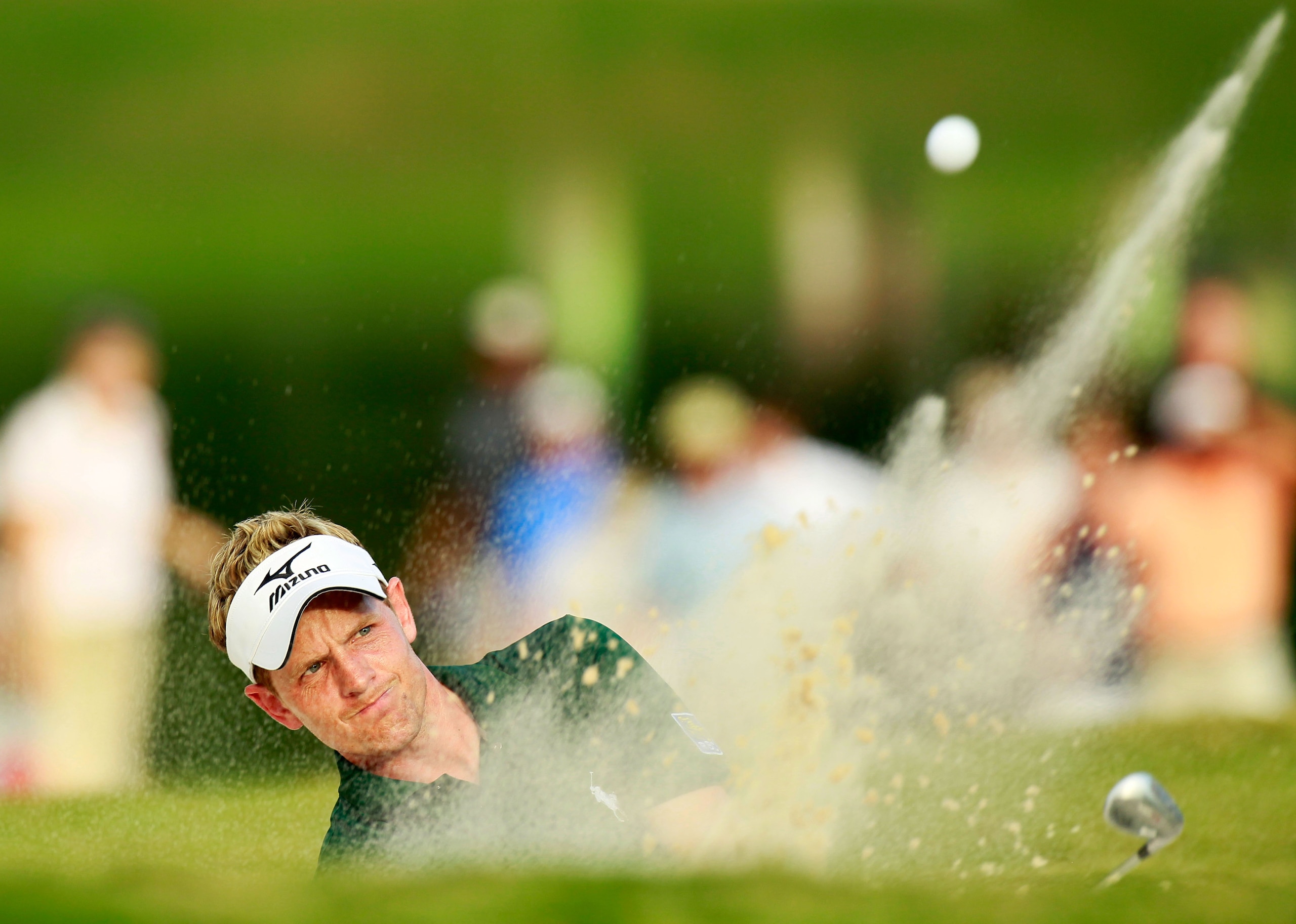 ATLANTA - SEPTEMBER 24:  Luke Donald of England chips out of the sand onto the 18th green during the second round of THE TOUR Championship presented by Coca-Cola at East Lake Golf Club on September 24, 2010 in Atlanta, Georgia.  (Photo by Kevin C. Cox/Get