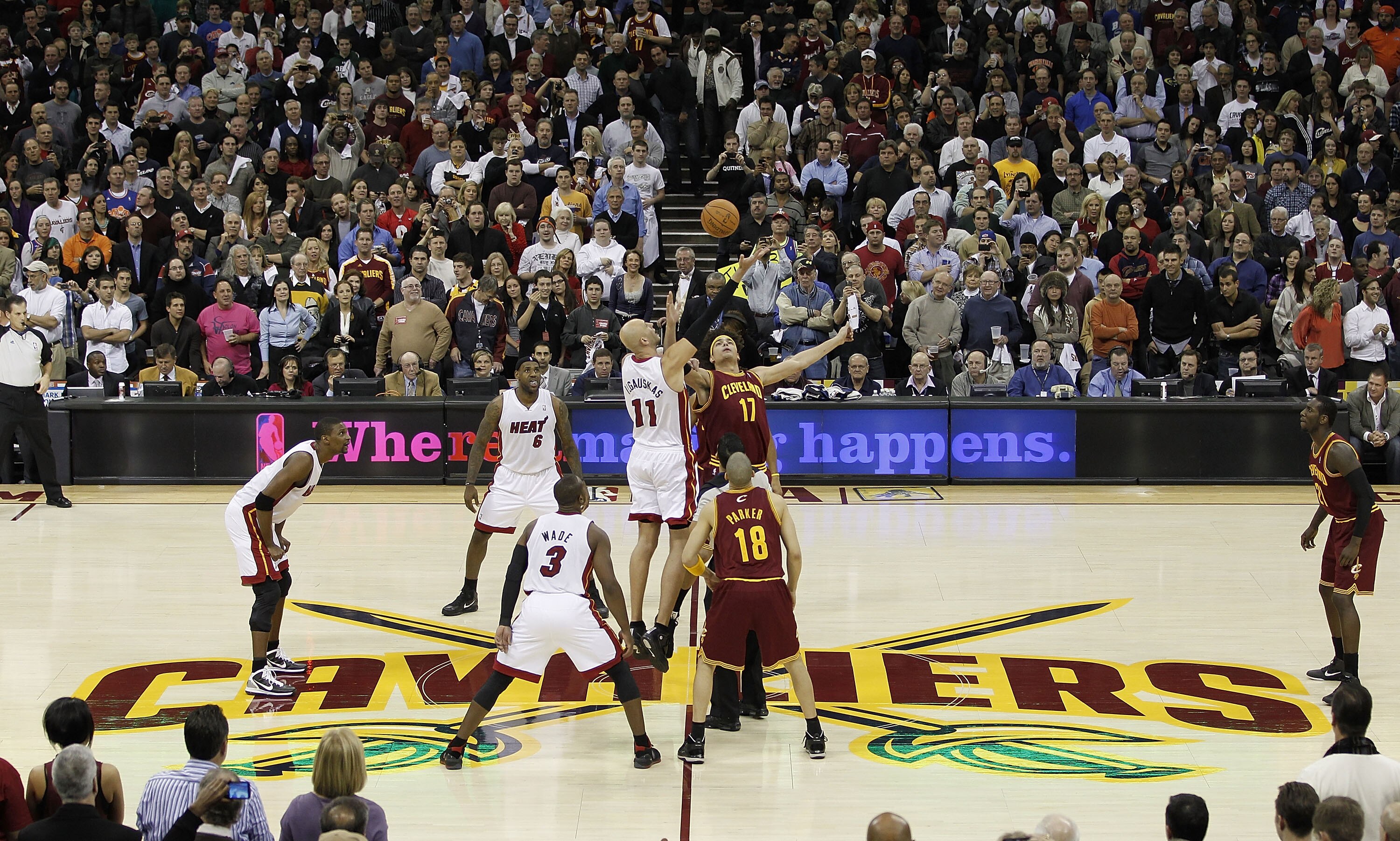 CLEVELAND, OH - DECEMBER 02:  Anderson Varejao #17 of the Cleveland Cavaliers jumps for the opening tip against Zydrunas Ilgauskas #11 of the Miami Heat with LeBron James #6 looking on at Quicken Loans Arena on December 2, 2010 in Cleveland, Ohio. NOTE TO