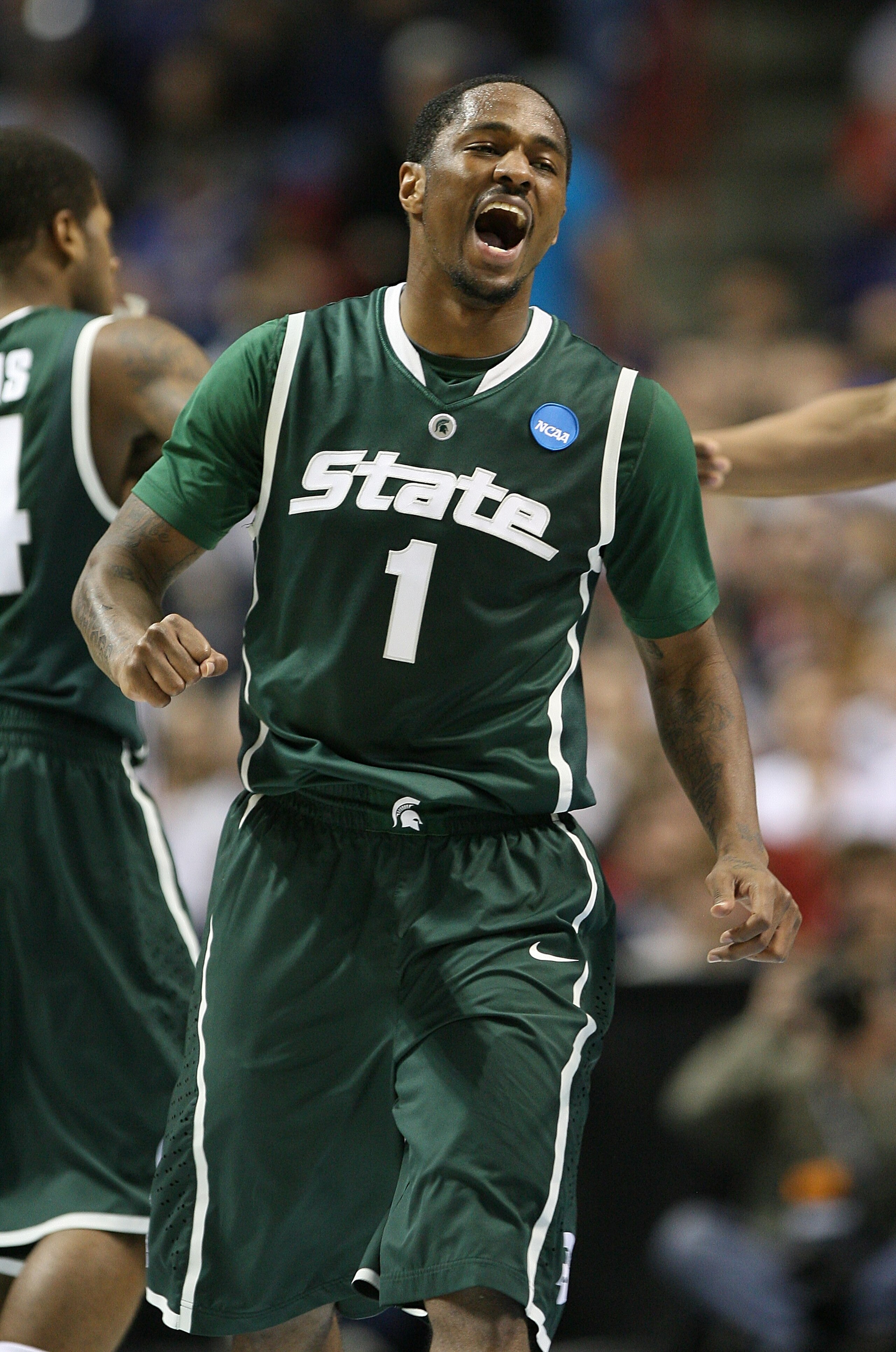 SPOKANE, WA - MARCH 21:  Kalin Lucas #1 of the Michigan State Spartans reacts after a teammate scored against the Maryland Terrapins during the second round of the 2010 NCAA men's basketball tournament at the Spokane Arena on March 21, 2010 in Spokane, Wa