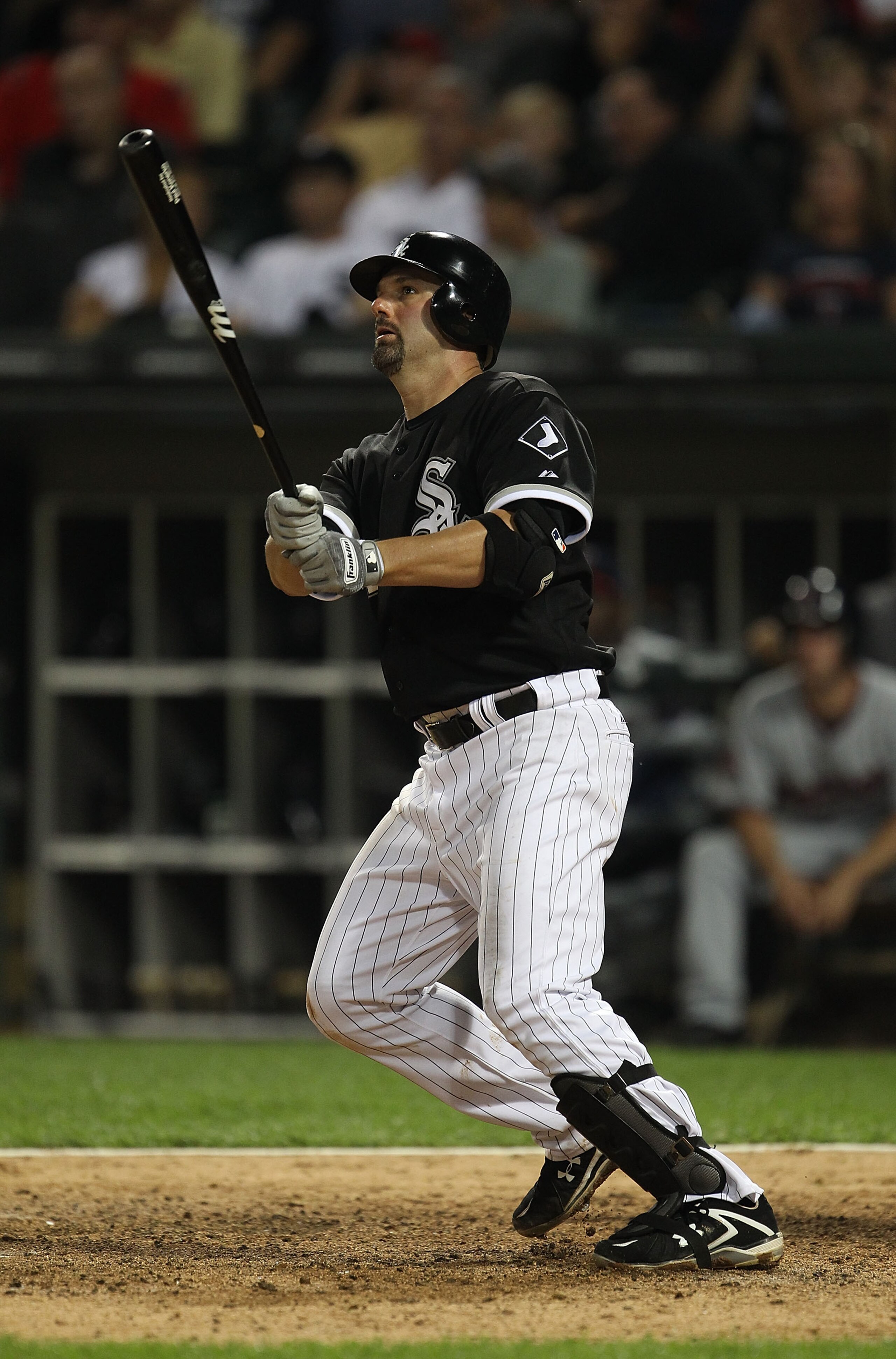 CHICAGO - AUGUST 10: Paul Konerko #14 of the Chicago White Sox hits a double against the Minnesota Twins at U.S. Cellular Field on August 10, 2010 in Chicago, Illinois. The Twins defeated the White Sox 12-6. (Photo by Jonathan Daniel/Getty Images)
