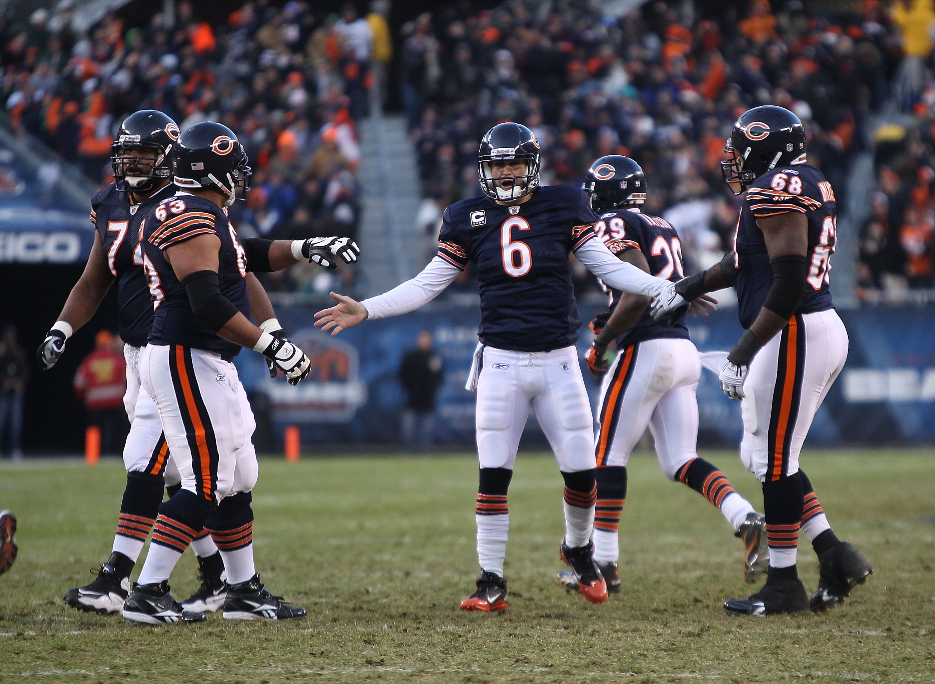 CHICAGO - NOVEMBER 28: Jay Cutler #6 of the Chicago Bears congratulates teammates (L-R) Chris Williams #74, Roberto Garza #63 and Frank Omiyale #68 after a touchdown throw against the Philadelphia Eagles at Soldier Field on November 28, 2010 in Chicago, I