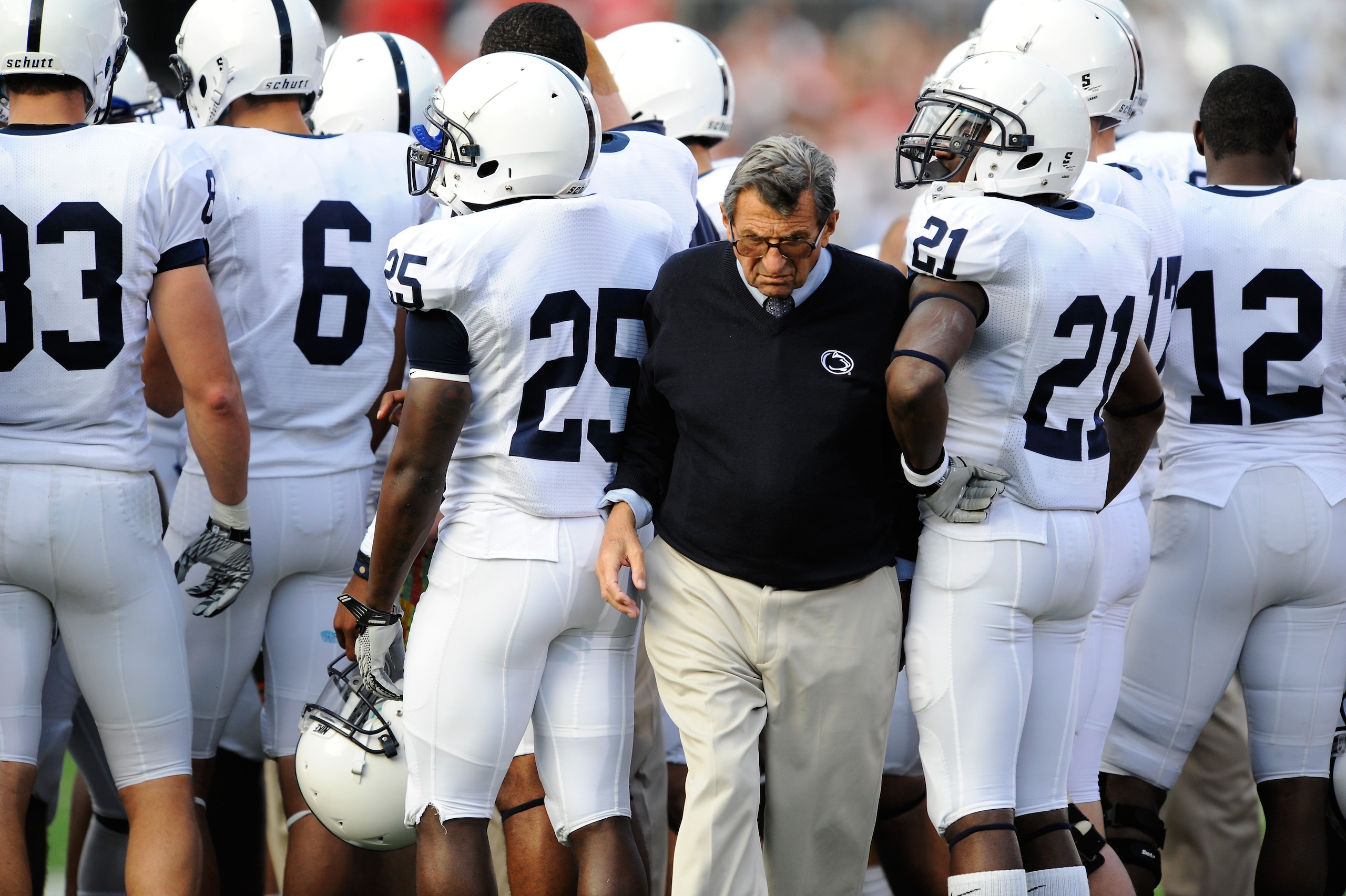 COLUMBUS, OH - NOVEMBER 13:  Head Coach Joe Paterno of the Penn State Nittany Lions pushes his way through a group of his players during a timeout in a game against the Ohio State Buckeyes at Ohio Stadium on November 13, 2010 in Columbus, Ohio.  (Photo by