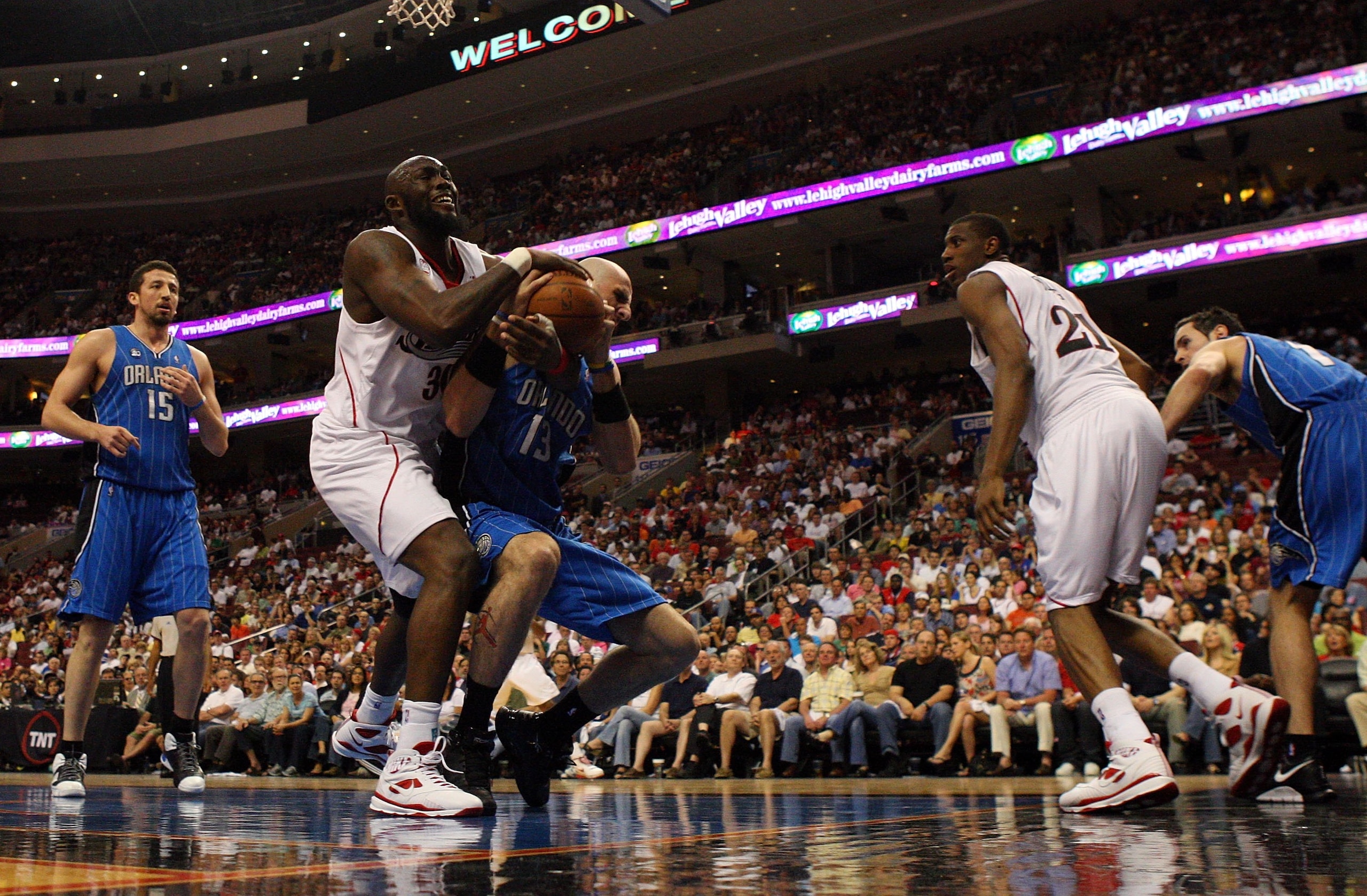 PHILADELPHIA - APRIL 26:  Reggie Evans #33 of the Philadelphia 76ers battles for the ball against Marcin Gortat #13 of the Orlando Magic during Game Four of the Eastern Conference Quarterfinals during the 2009 NBA Playoffs at the Wachovia Center on April