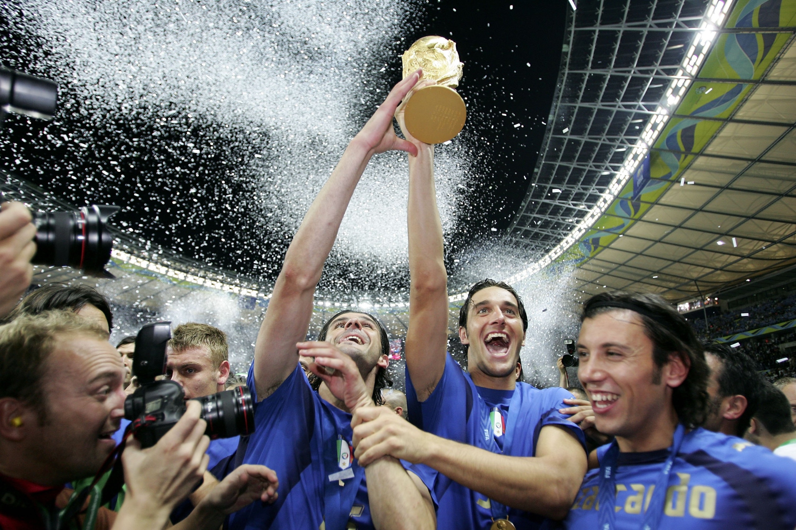 BERLIN - JULY 09:  Italian players celebrate with the world cup trophy after their team's victory during the FIFA World Cup Germany 2006 Final match between Italy and France at the Olympic Stadium on July 9, 2006 in Berlin, Germany.  (Photo by Michael Ste
