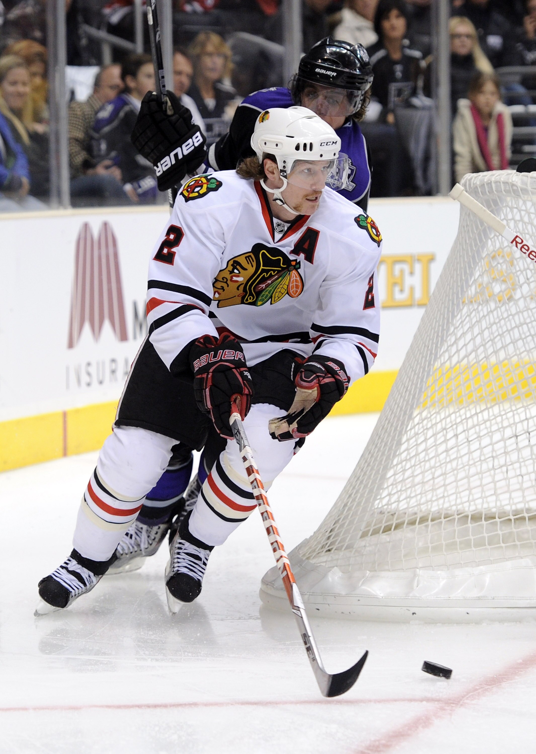 LOS ANGELES, CA - NOVEMBER 27:  Duncan Keith #2 of the Chicago Blackhawks skates away from Anze Kopitar #11 of the Los Angeles Kings during the game at Staples Center on November 27, 2010 in Los Angeles, California.  (Photo by Harry How/Getty Images)