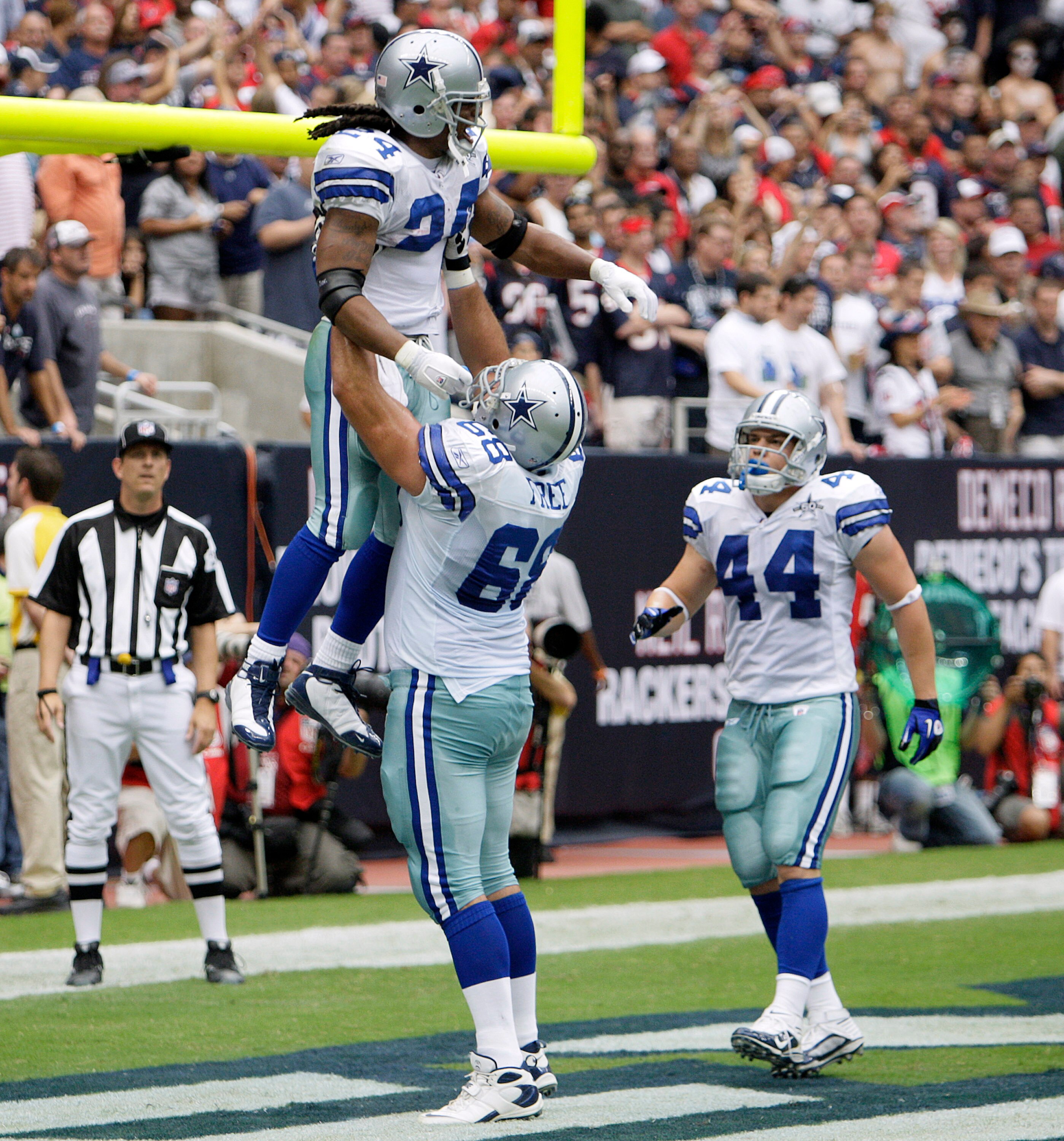 HOUSTON - SEPTEMBER 26:  Running back Marion Barber #24 of the Dallas Cowboys is lifted up by Doug Free #68 after scoring in the second quarter as Chris Gronkowski #44 looks on against the Houston Texans at Reliant Stadium on September 26, 2010 in Houston