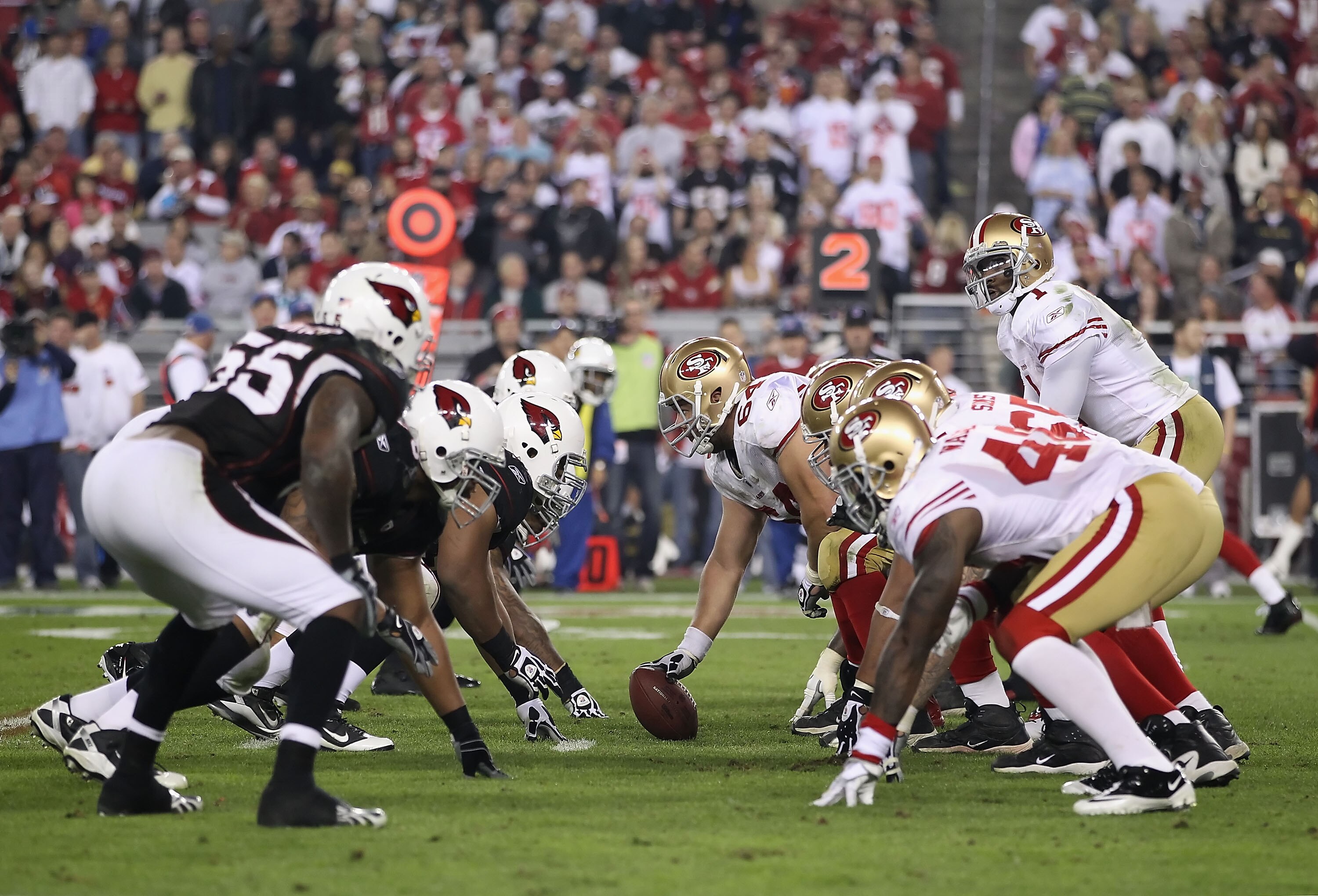 GLENDALE, AZ - NOVEMBER 29:  Center David Baas #64 of the San Francisco 49ers prepares to snap the football to Troy Smith #1 during the NFL game against the Arizona Cardinals at the University of Phoenix Stadium on November 29, 2010 in Glendale, Arizona.