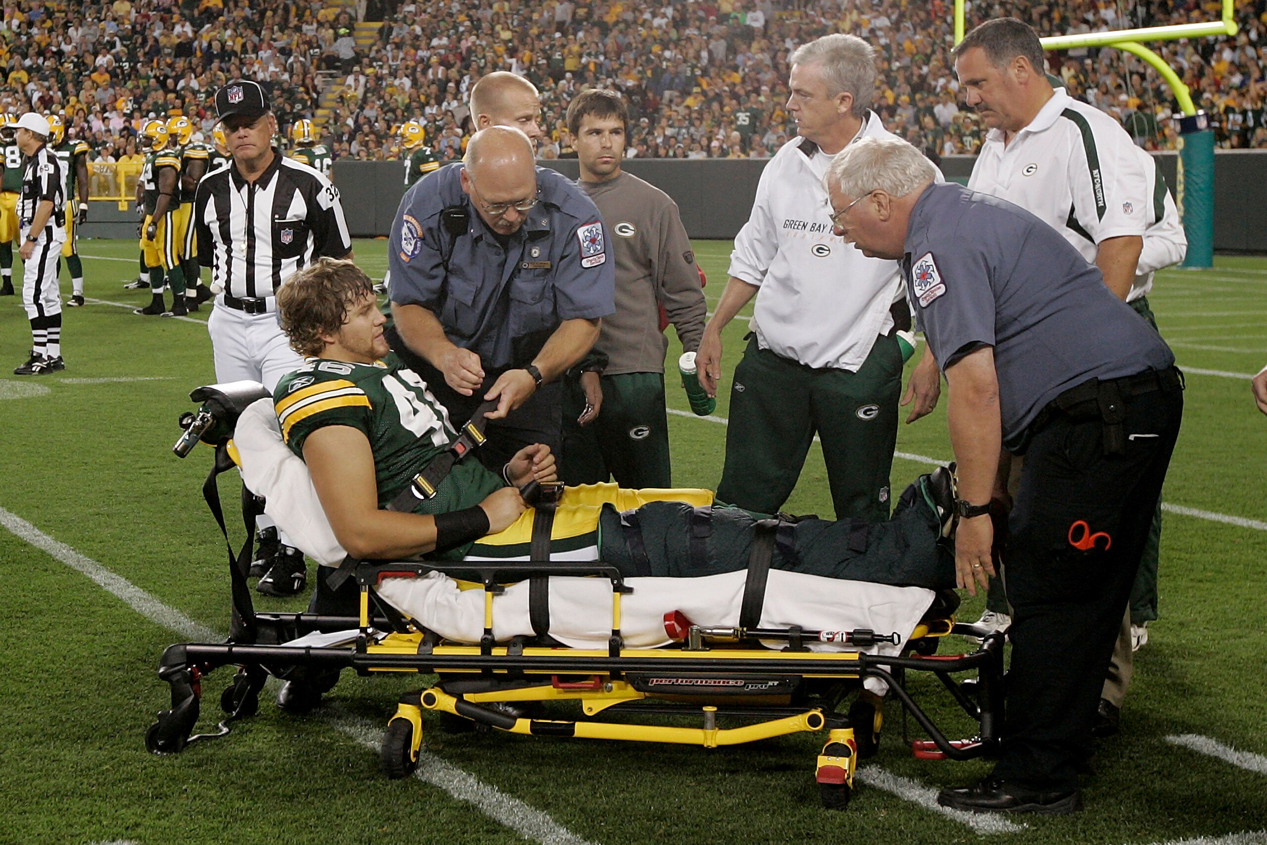 GREEN BAY, WI - AUGUST 22: Tight end Devin Frishknecht #46 of the Green Bay Packers is placed on a stretcher to be taken off the field after an injury against the Buffalo Bills at Lambeau Field on August 22, 2009 in Green Bay. Wisconsin. The Packers defea