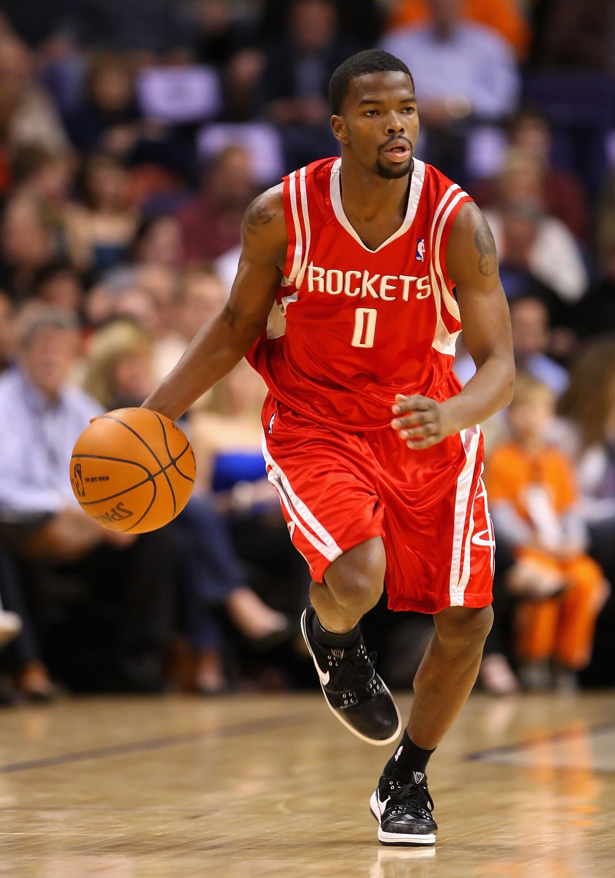 PHOENIX - JANUARY 06:  Aaron Brooks #0 of the Houston Rockets handles the ball during the NBA game against the Phoenix Suns at US Airways Center on January 6, 2010 in Phoenix, Arizona. The Suns defeated the Rockets 118-110.  NOTE TO USER: User expressly a