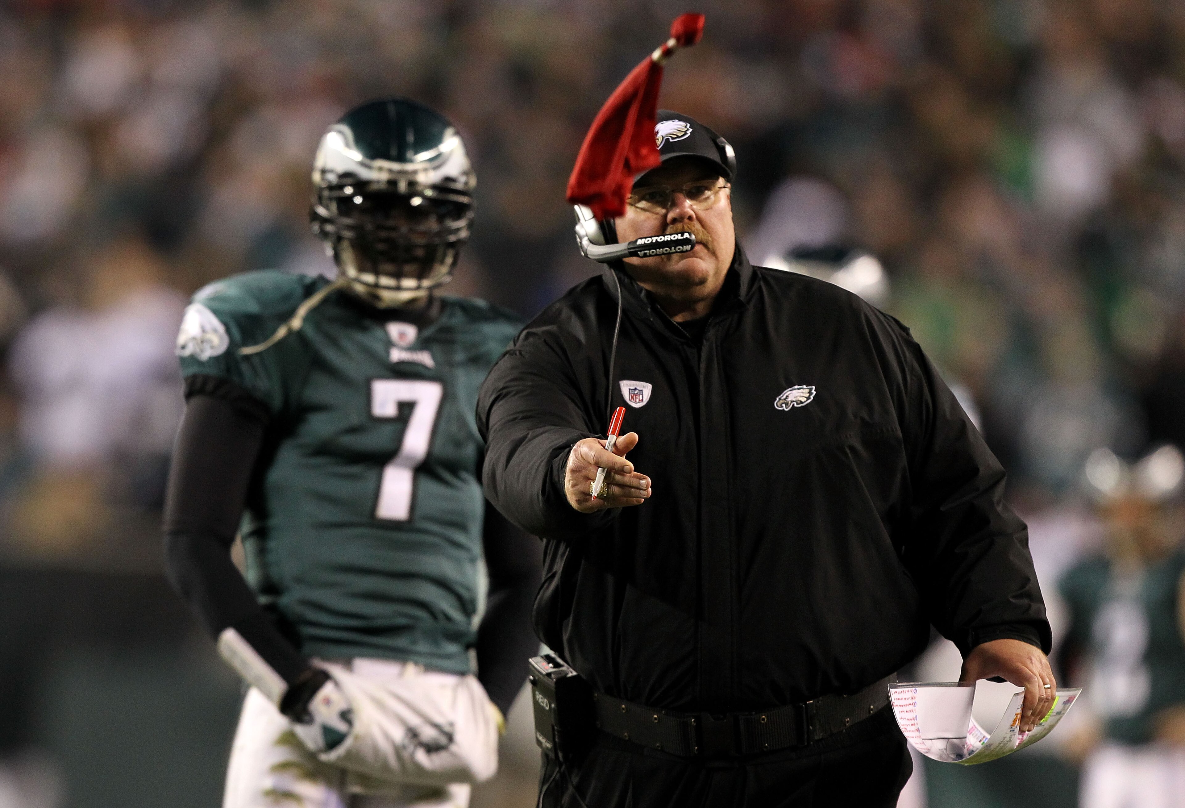 PHILADELPHIA, PA - DECEMBER 02: Head coach Andy Reid of the Philadelphia Eagles throws the red challenge flag on a play involving Brent Celek #87 in the second half as Michael Vick #7 looks on against the Houston Texans at Lincoln Financial Field on Dece PHILADELPHIA, PA - DECEMBER 02: Head coach Andy Reid of the Philadelphia Eagles throws the red challenge flag on a play involving Brent Celek #87 in the second half as Michael Vick #7 looks on against the Houston Texans at Lincoln Financial Field on Dece