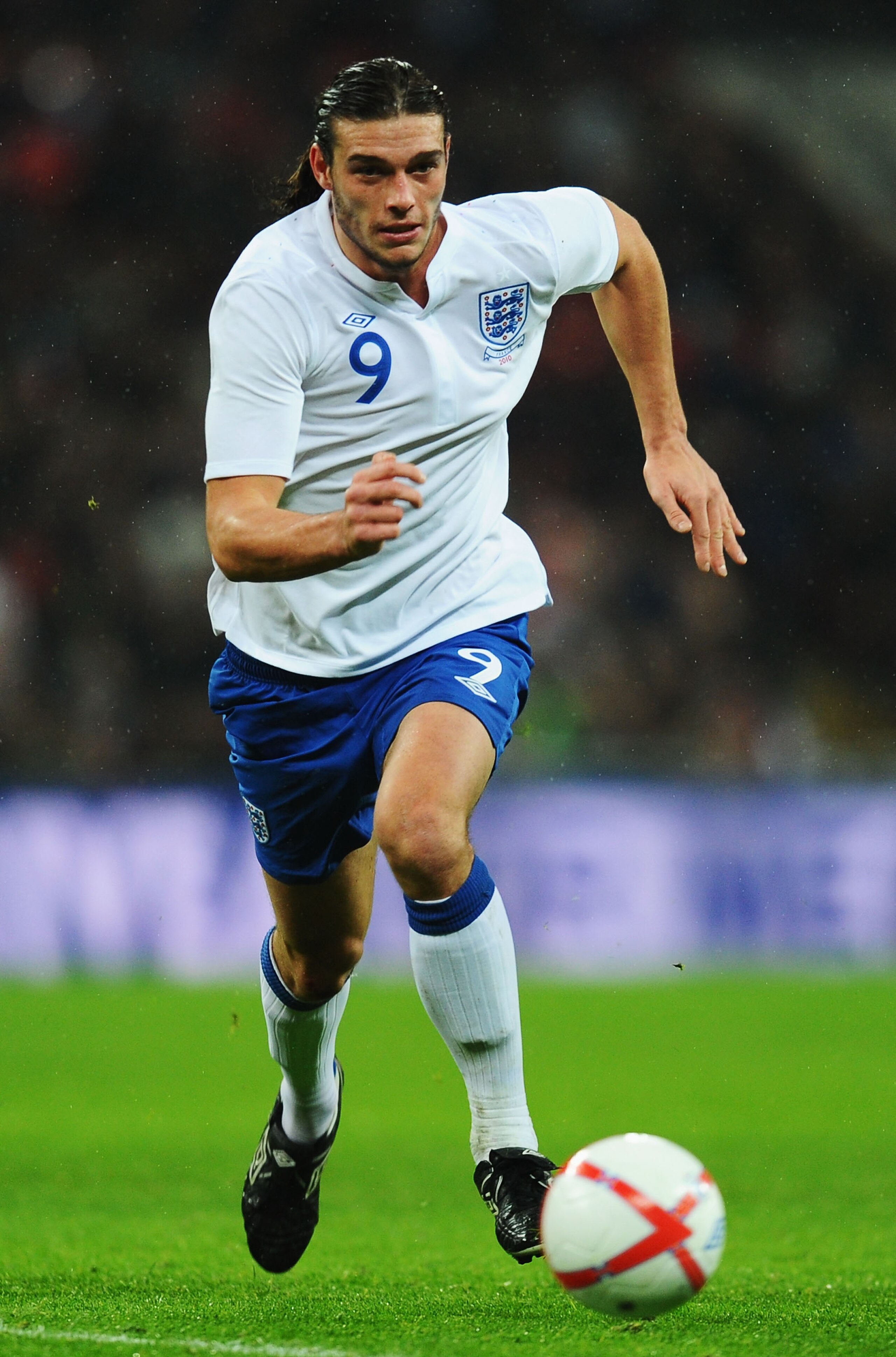LONDON, ENGLAND - NOVEMBER 17:  Andy Carroll of England runs with the ball during the international friendly match between England and France at Wembley Stadium on November 17, 2010 in London, England.  (Photo by Mike Hewitt/Getty Images)