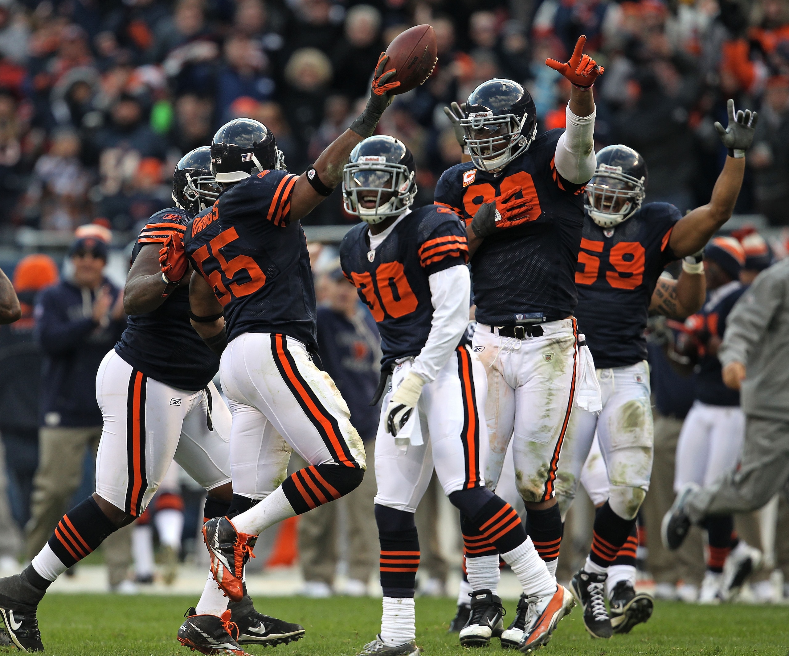 CHICAGO - NOVEMBER 14: Members of the Chicago Bear defense including (L-R) Lance Briggs #55, D.J.Moore #30, Julius Peppers #90 and Pisa Tinoisamoa #59 celebrate Brigg's interception against the Minnesota Vikings at Soldier Field on November 14, 2010 in Ch CHICAGO - NOVEMBER 14: Members of the Chicago Bear defense including (L-R) Lance Briggs #55, D.J.Moore #30, Julius Peppers #90 and Pisa Tinoisamoa #59 celebrate Brigg's interception against the Minnesota Vikings at Soldier Field on November 14, 2010 in Ch