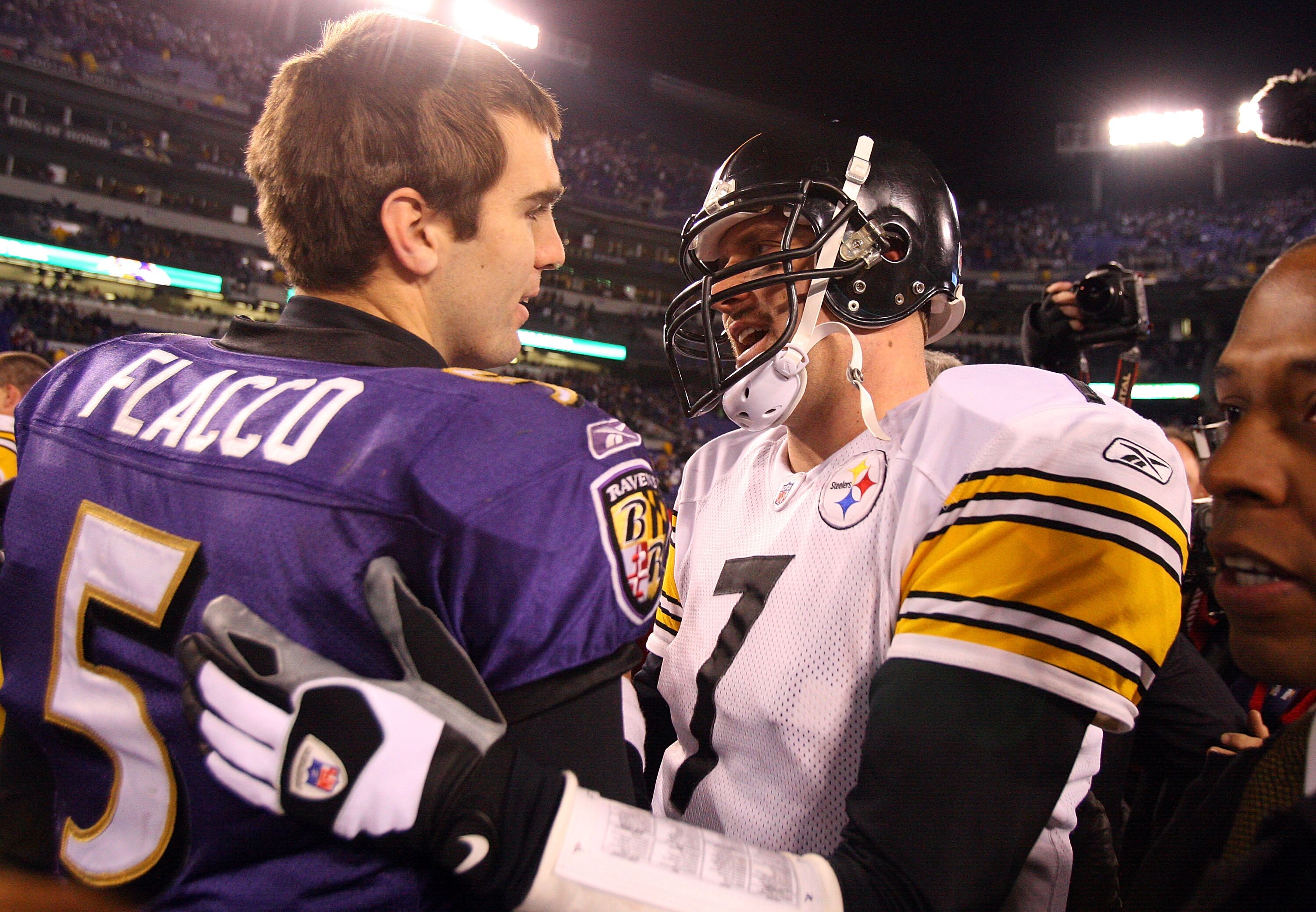 BALTIMORE - DECEMBER 14:  Joe Flacco #5 of the Baltimore Ravens meets with Ben Roethlisberger #7 of the Pittsburgh Steelers on December 14, 2008 at M&T Bank Stadium in Baltimore, Maryland. The Steelers defeated the Ravens 13-9.  (Photo by Jim McIsaac/Gett