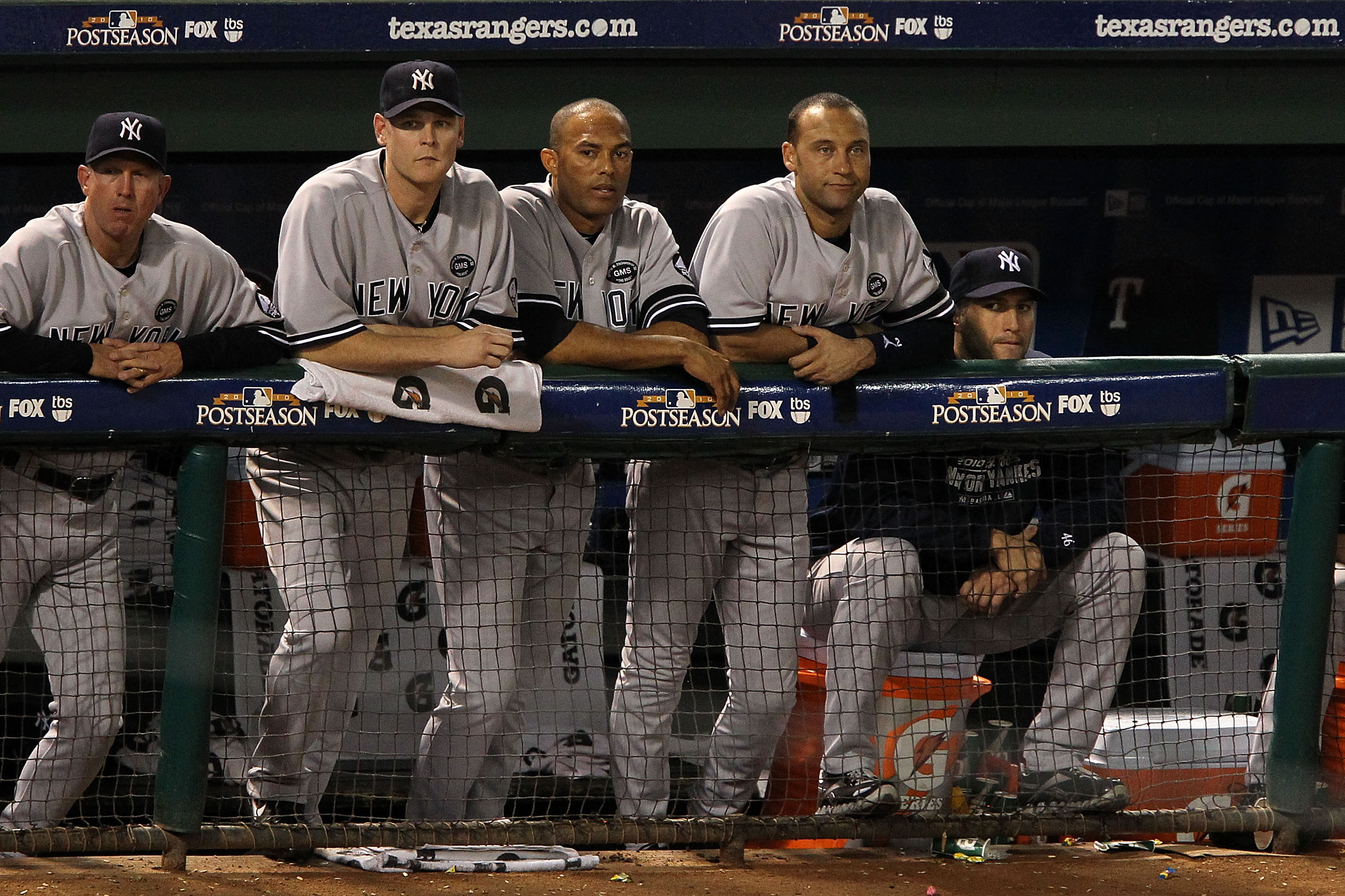 ARLINGTON, TX - OCTOBER 22:  (2nd from L-R) Kerry Wood #39, Mariano Rivera #42, Derek Jeter #2, and Andy Pettitte #46 of the New York Yankees look on from the dugout during Game Six of the ALCS against the Texas Rangers during the 2010 MLB Playoffs at Ran