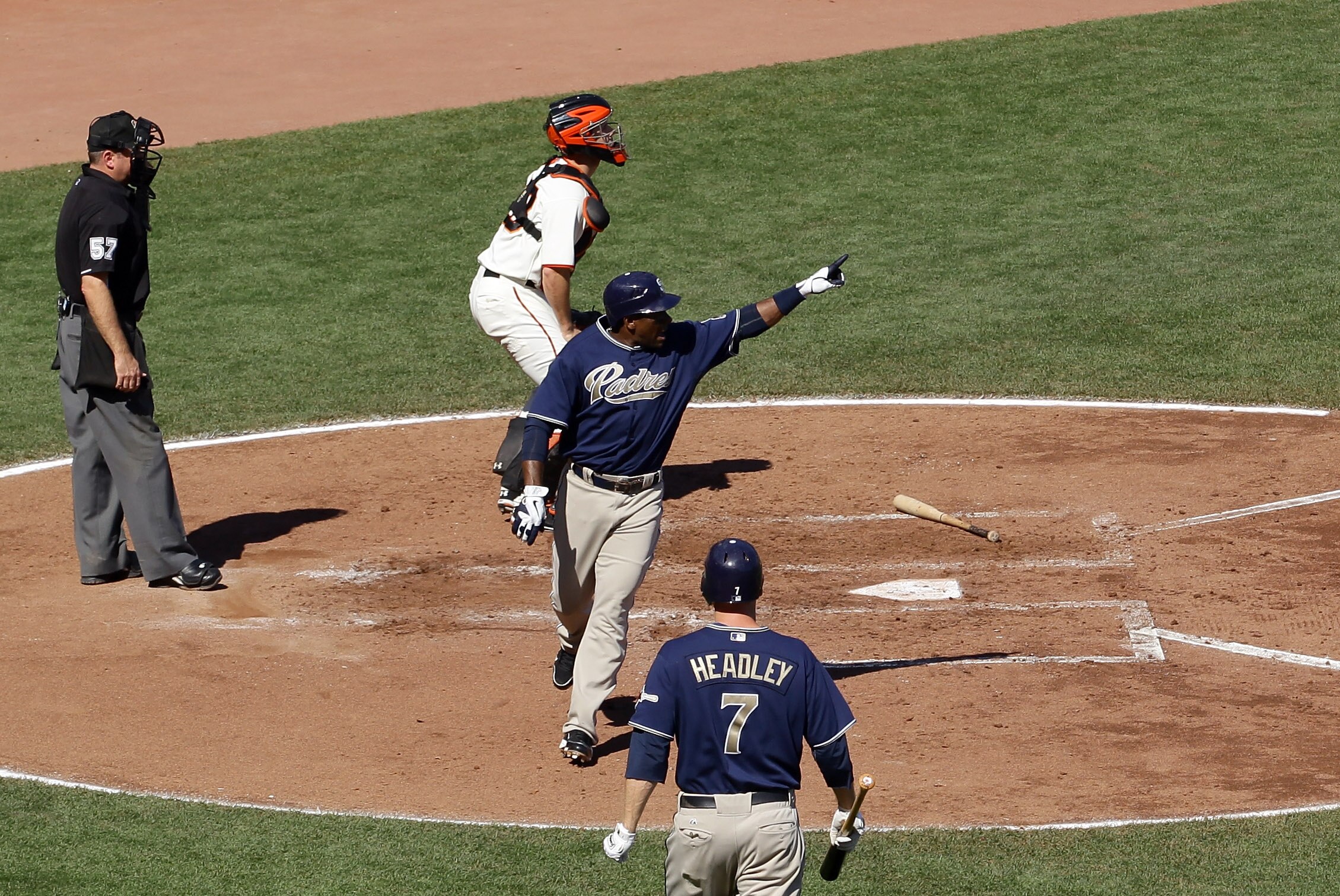 SAN FRANCISCO - OCTOBER 02:  Miguel Tejada #10 of the San Diego Padres points out to second base where Adrian Gonzalez avoided a tag that allowed Tejada to score to give the Padres a 3-0 lead over the San Francisco Giants slides in to second base at AT&T