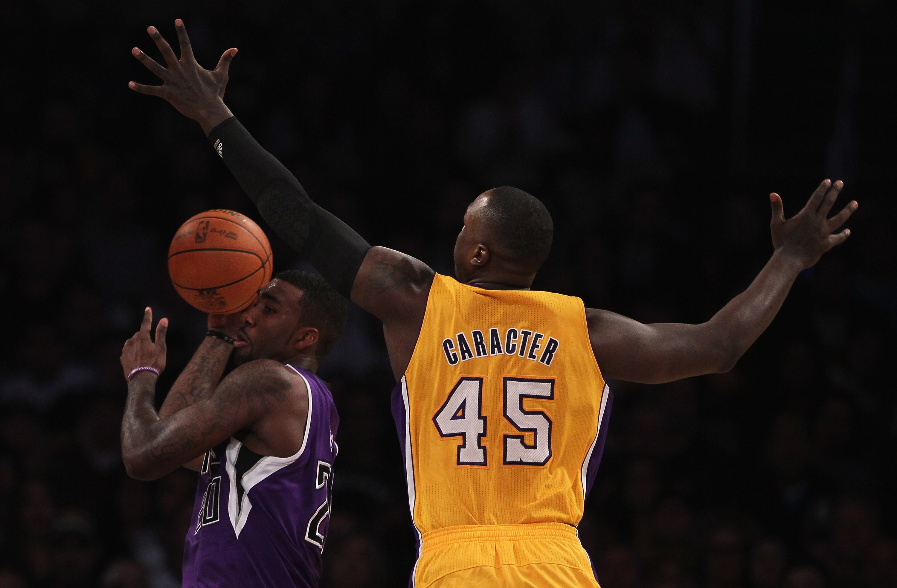 LOS ANGELES, CA - DECEMBER 03:  Donte Greene #20 of the Sacramento Kings drives to the basket while being defended by Derrick Caracter #45 of the Los Angeles Lakers during the first half at Staples Center on December 3, 2010 in Los Angeles, California. Th
