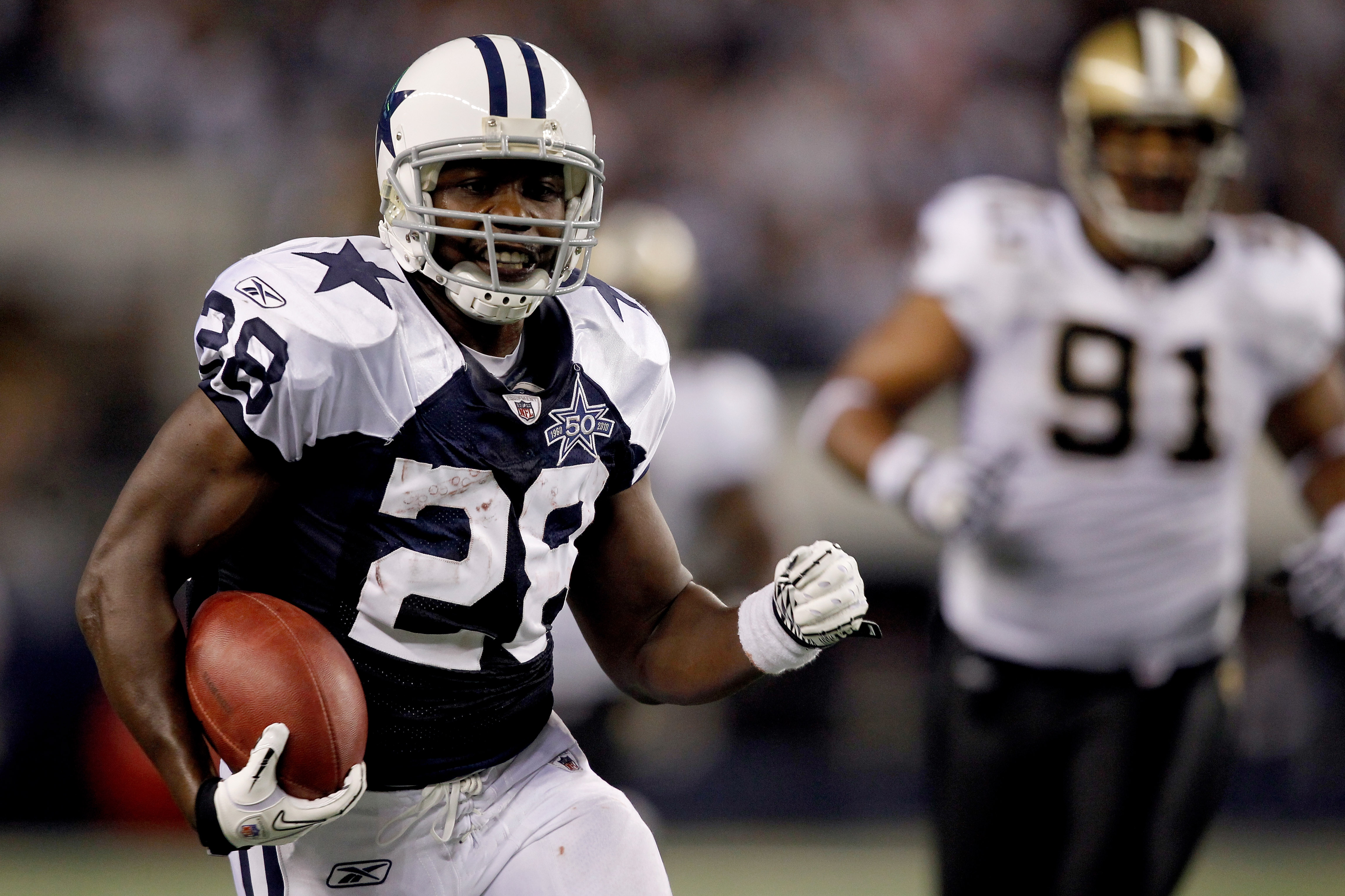 ARLINGTON, TX - NOVEMBER 25:  Felix Jones #28 of the Dallas Cowboys at Cowboys carries the ball after making a reception against the New Orleans Saints at Cowboys Stadium on November 25, 2010 in Arlington, Texas.  (Photo by Matthew Stockman/Getty Images)