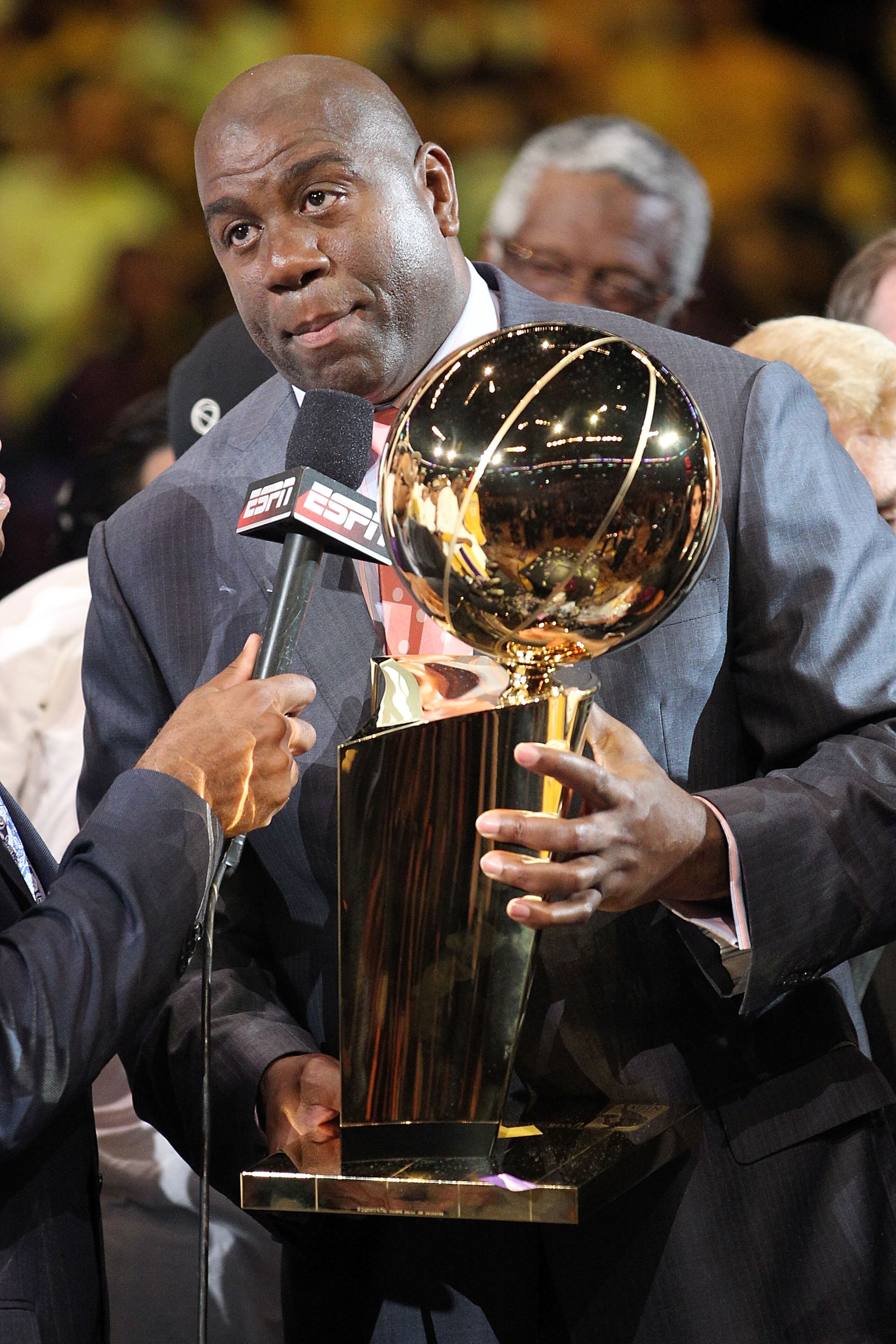 LOS ANGELES, CA - JUNE 17:  Earvin 'Magic' Johnson holds the Larry O'Brien Trophy after the Lakers defeated the Boston Celtics in Game Seven of the 2010 NBA Finals at Staples Center on June 17, 2010 in Los Angeles, California.  NOTE TO USER: User expressl