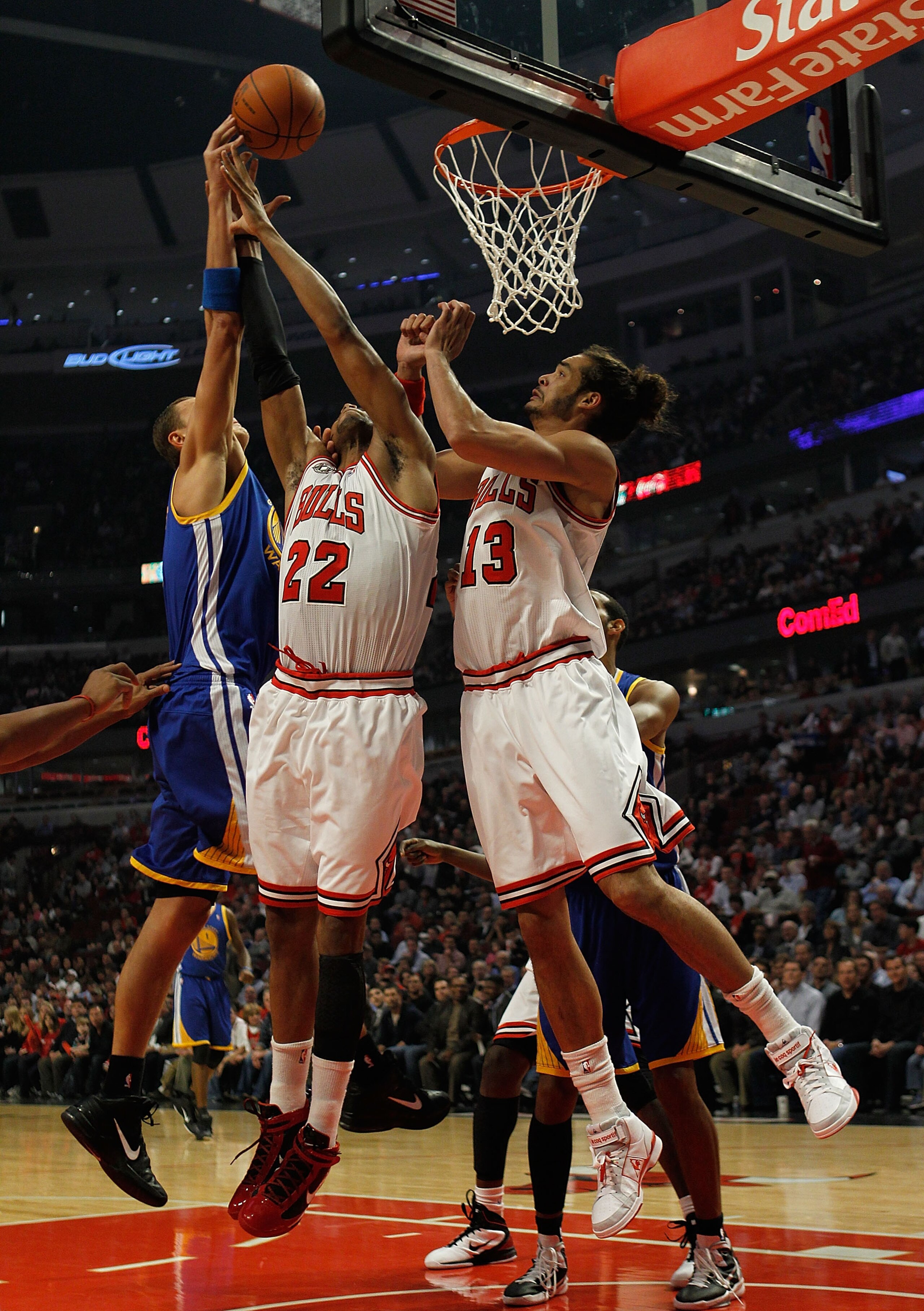 CHICAGO - NOVEMBER 11: Andris Biedrins #15 of the Golden State Warriors battles for a rebound with Taj Gibson #22 and Joakim Noah #13 of the Chicago Bulls at the United Center on November 11, 2010 in Chicago, Illinois. NOTE TO USER: User expressly acknowl
