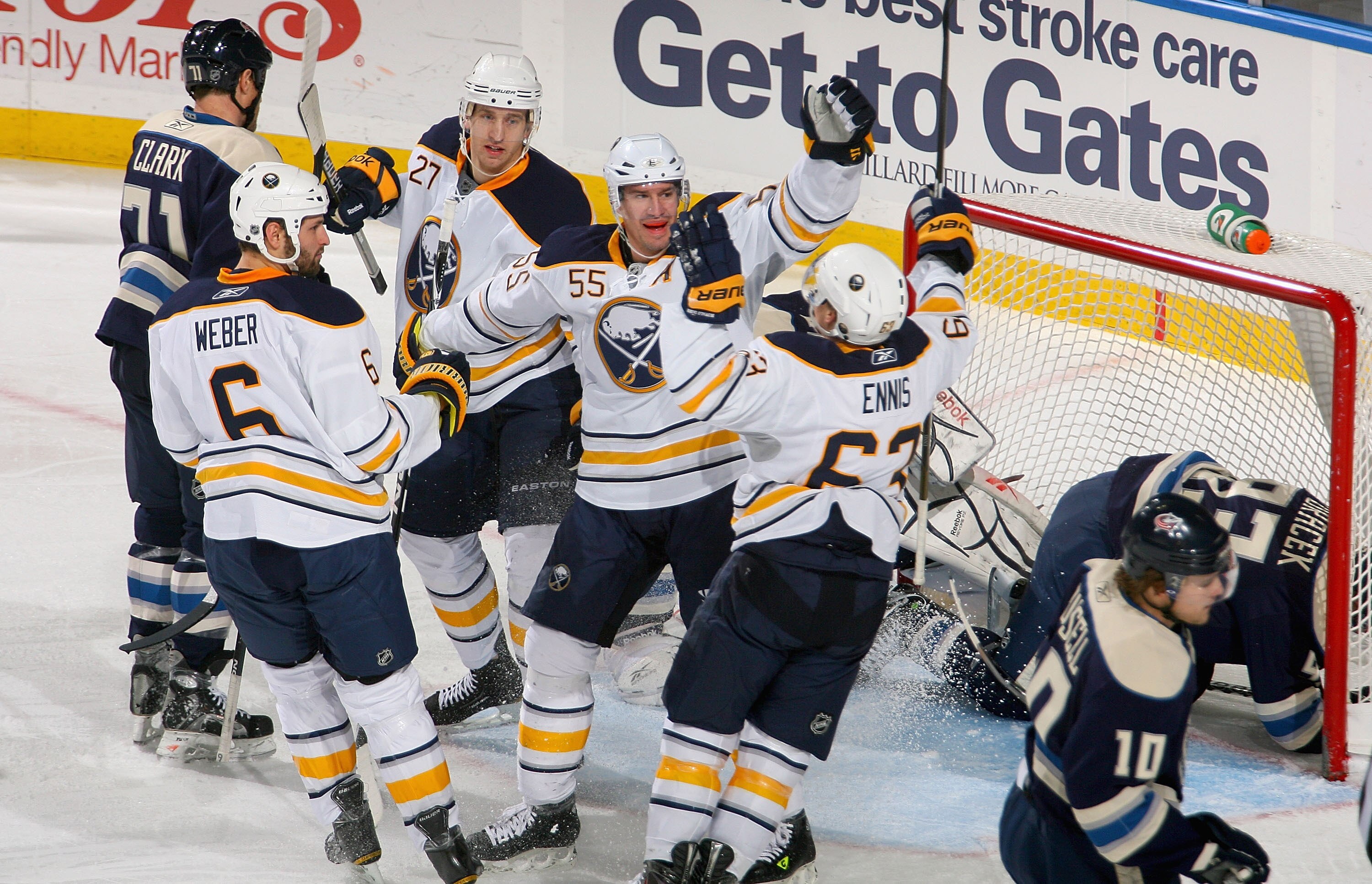 BUFFALO, NY - DECEMBER 03: Mike Weber #6, Shaone Morrisonn #27, Jochen Hecht #55 and Tyler Ennis #63 of the Buffalo Sabres celebrate Hecht's goal in the first period against the Columbus Blue Jackets at HSBC Arena  on December 3, 2010 in Buffalo, New York