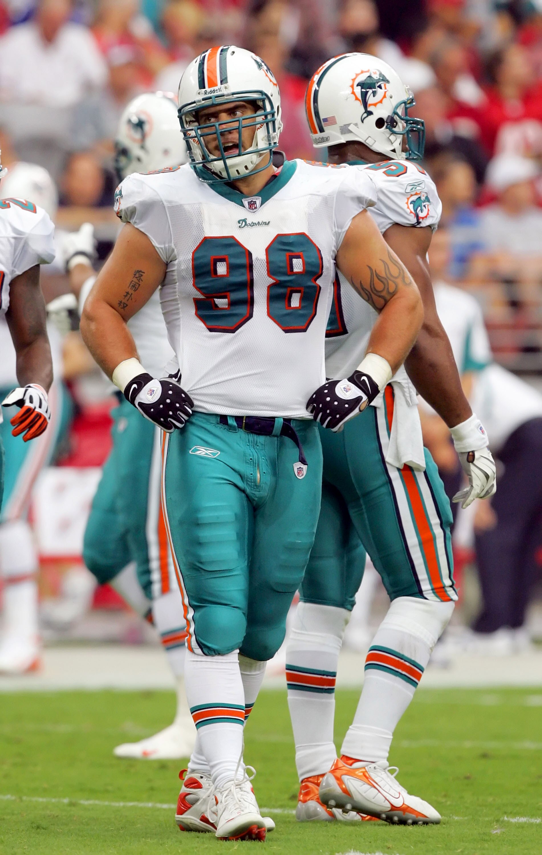 GLENDALE, AZ - SEPTEMBER 14:  Matt Roth #98 of the Miami Dolphins reacts during the first half against the Arizona Cardinals at University of Phoenix Stadium on September 14, 2008 in Glendale, Arizona.  (Photo by Lisa Blumenfeld/Getty Images)