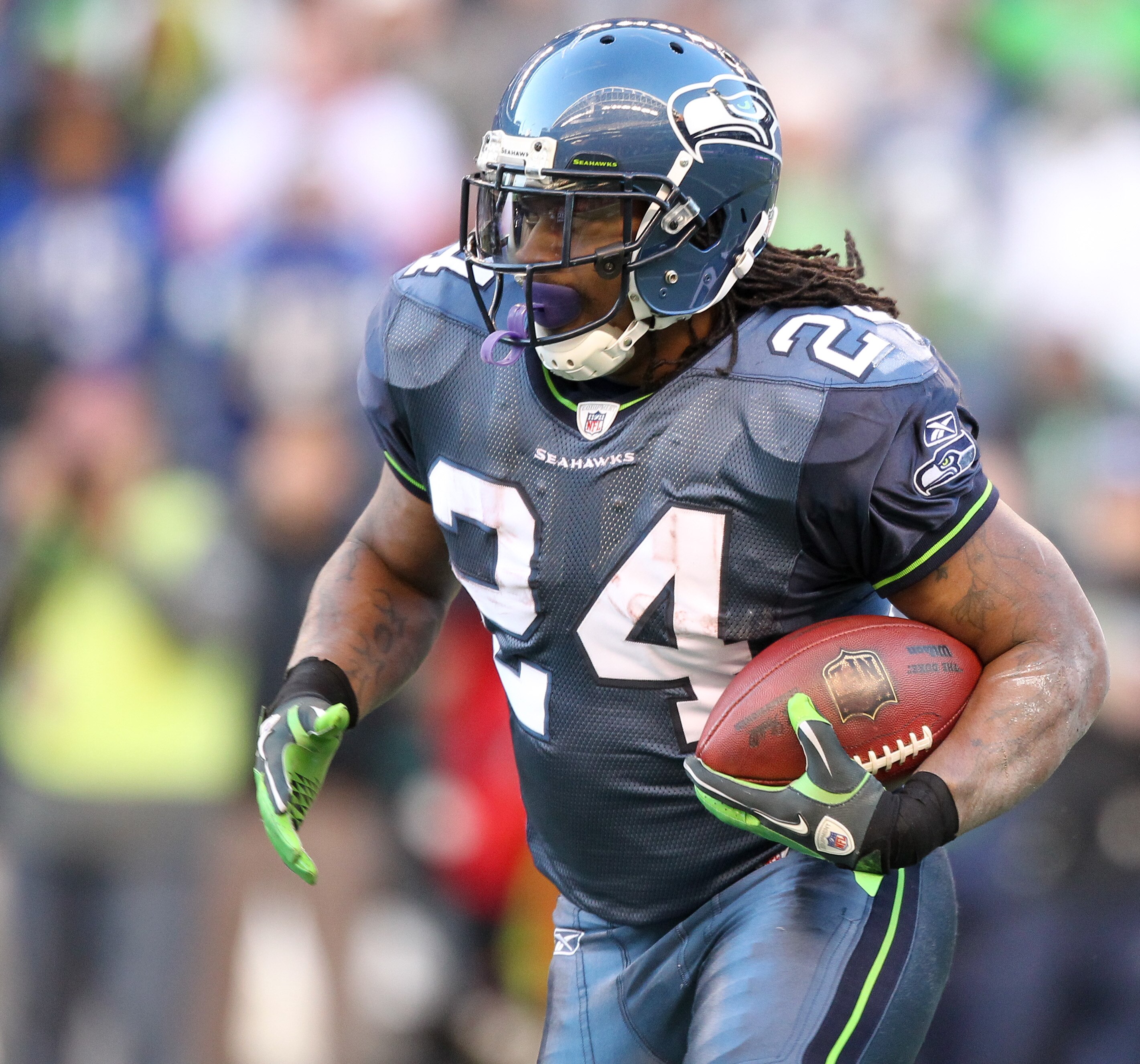 SEATTLE, WA - NOVEMBER 28:  Running back Marshawn Lynch #24 of the Seattle Seahawks rushes against the Kansas City Chiefs at Qwest Field on November 28, 2010 in Seattle, Washington. (Photo by Otto Greule Jr/Getty Images)