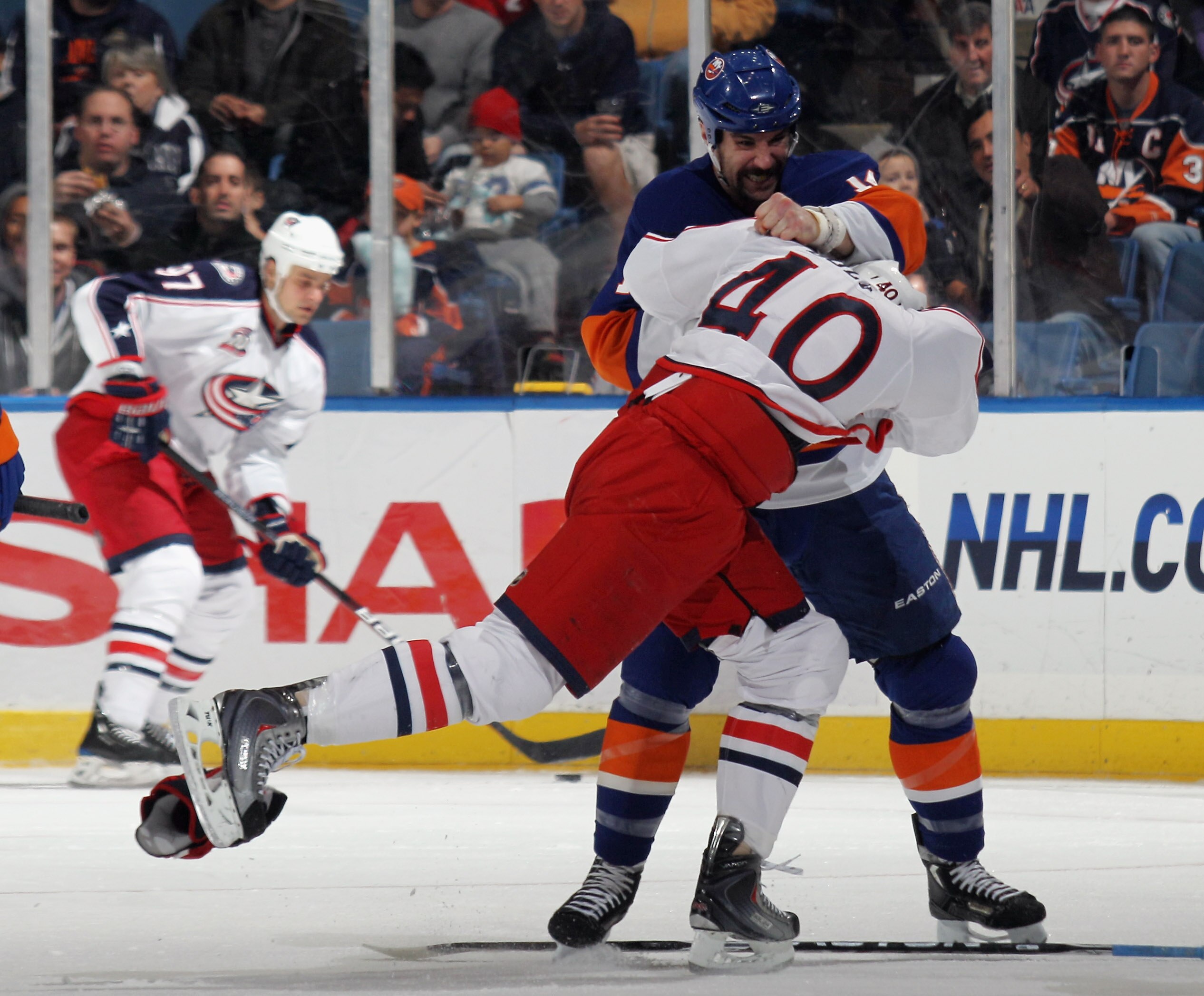 UNIONDALE, NY - NOVEMBER 24: Jared Boll #40 of the Columbus Blue Jackets squares off with Trevor Gillies #14 of the New York Islanders at the Nassau Coliseum on November 24, 2010 in Uniondale, New York.  (Photo by Bruce Bennett/Getty Images)