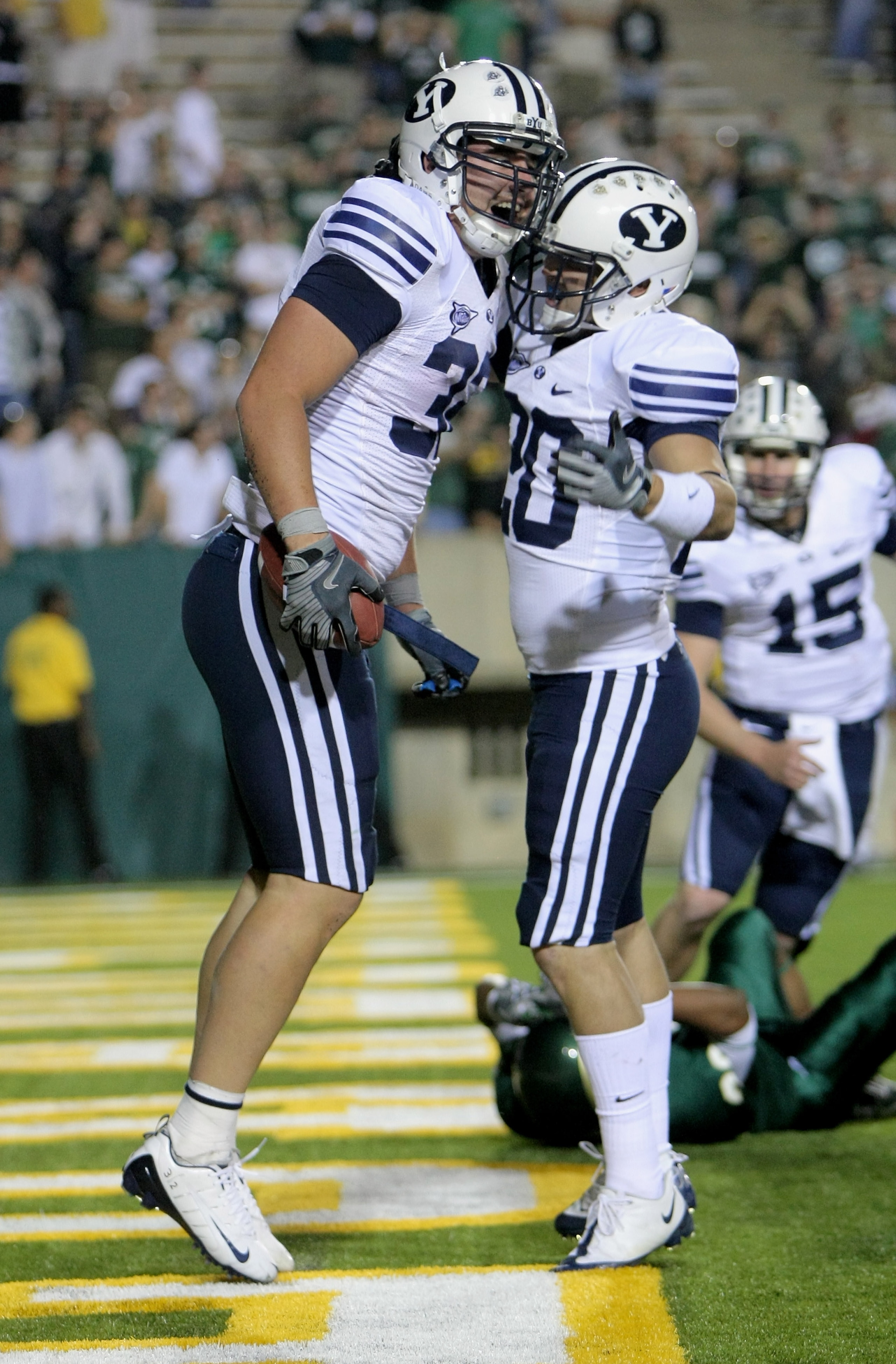 FORT COLLINS, CO - NOVEMBER 01:  Dennis Pitta #32 of the Brigham Young Cougars celebrates his game winning 17 yard touchdown reception with Reed White #20 with :22 seconds remaining against the Colorado State Rams at Sonny Lubick Field at Hughes Stadium o
