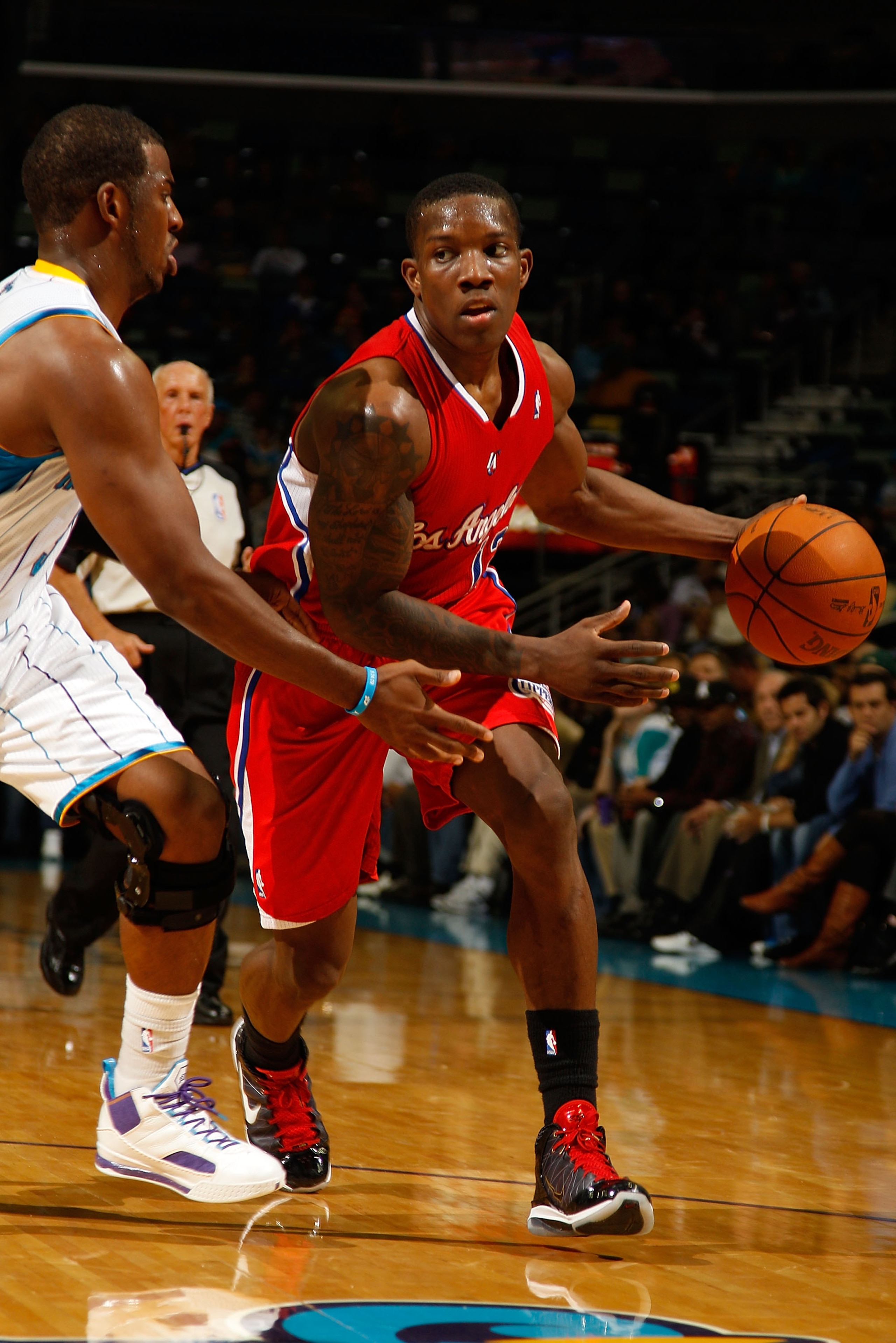 NEW ORLEANS - NOVEMBER 09:  Eric Bledsoe #12 of the Los Angeles Clippers drives the ball around Chris Paul #3 of the New Orleans Hornets at the New Orleans Arena on November 9, 2010 in New Orleans, Louisiana. The Hornets defeated the Clippers 101-82.   NO