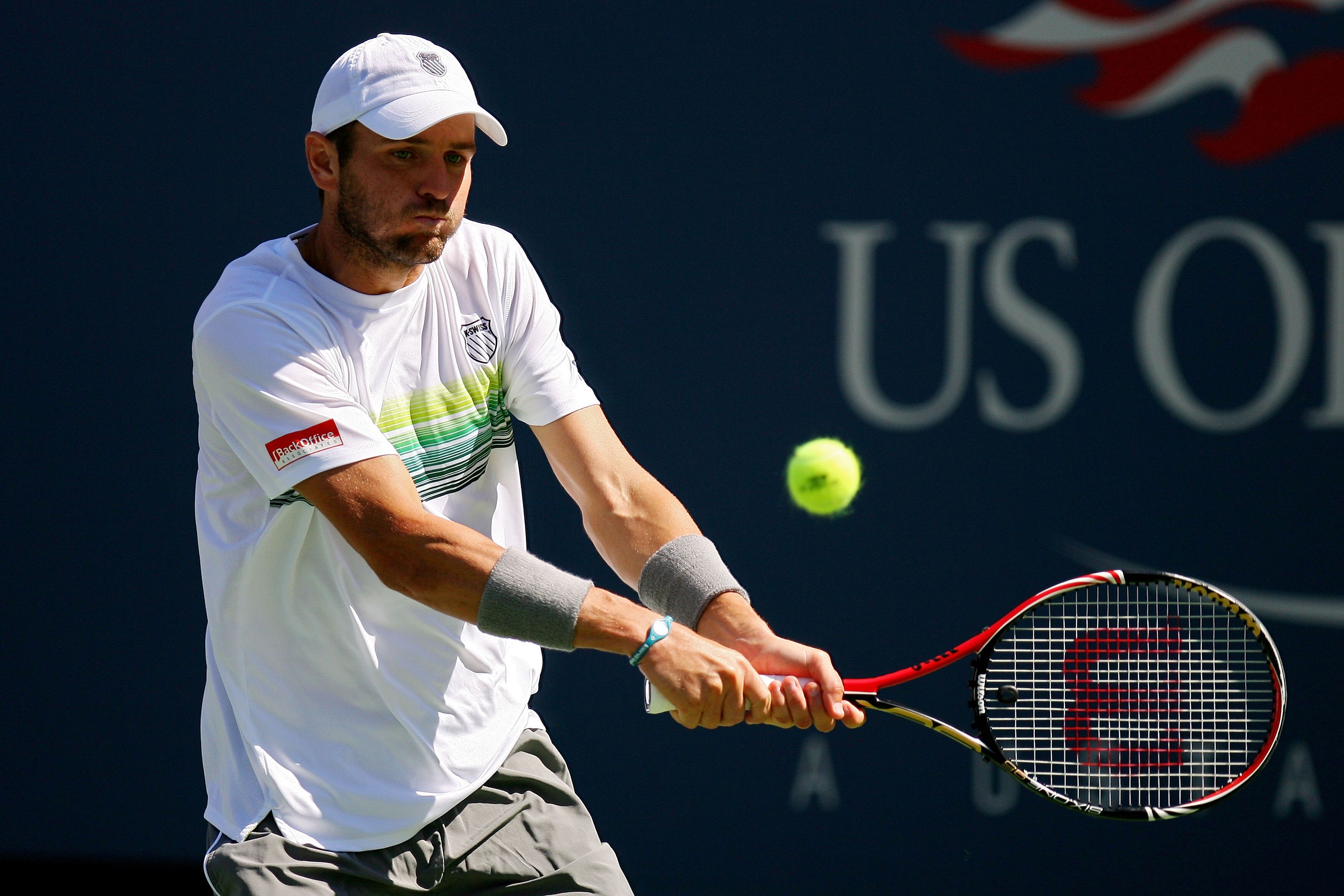 NEW YORK - SEPTEMBER 06:  Mardy Fish of the United States returns a shot against Novak Djokovic of Serbia during the men's singles match on day eight of the 2010 U.S. Open at the USTA Billie Jean King National Tennis Center on September 6, 2010 in the Flu