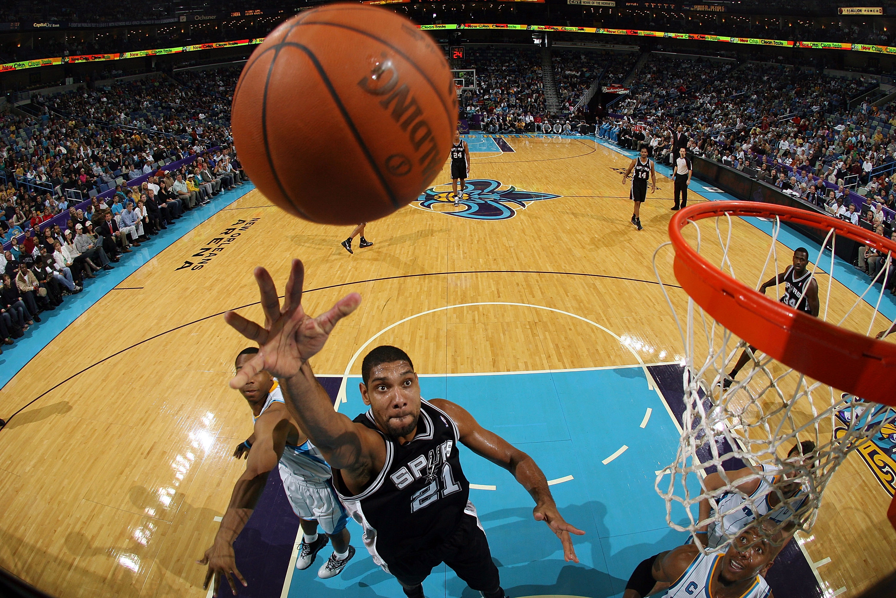 NEW ORLEANS - NOVEMBER 28: Tim Duncan #21 of the San Antonio Spurs shoots the ball over David West #30 of the New Orleans Hornets at the New Orleans Arena on November 28, 2010 in New Orleans, Louisiana. The Spurs defeated the Hornets 109-95. NOTE TO US NEW ORLEANS - NOVEMBER 28: Tim Duncan #21 of the San Antonio Spurs shoots the ball over David West #30 of the New Orleans Hornets at the New Orleans Arena on November 28, 2010 in New Orleans, Louisiana. The Spurs defeated the Hornets 109-95. NOTE TO US