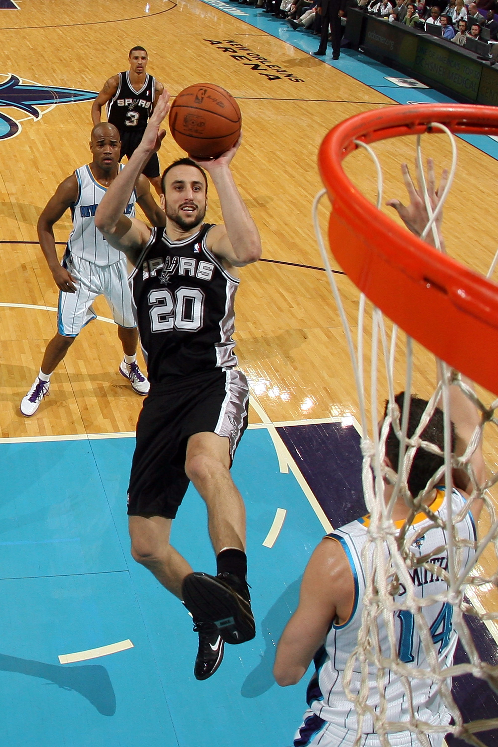 NEW ORLEANS - NOVEMBER 28: Manu Ginobili #20 of the San Antonio Spurs shoots the ball over Jason Smith #14 of the New Orleans Hornets at the New Orleans Arena on November 28, 2010 in New Orleans, Louisiana. The Spurs defeated the Hornets 109-95. NOTE T NEW ORLEANS - NOVEMBER 28: Manu Ginobili #20 of the San Antonio Spurs shoots the ball over Jason Smith #14 of the New Orleans Hornets at the New Orleans Arena on November 28, 2010 in New Orleans, Louisiana. The Spurs defeated the Hornets 109-95. NOTE T